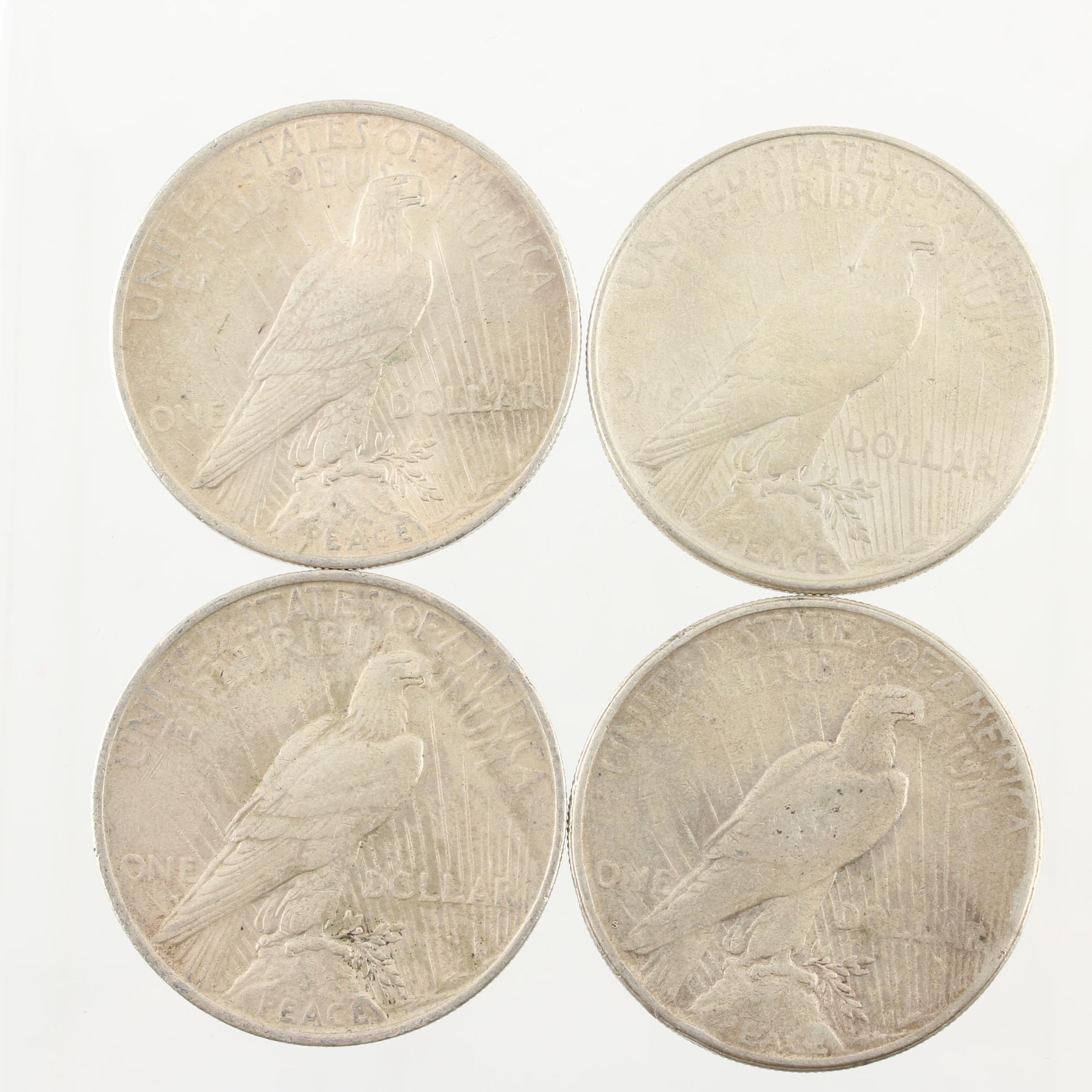 Four Peace Silver Dollars