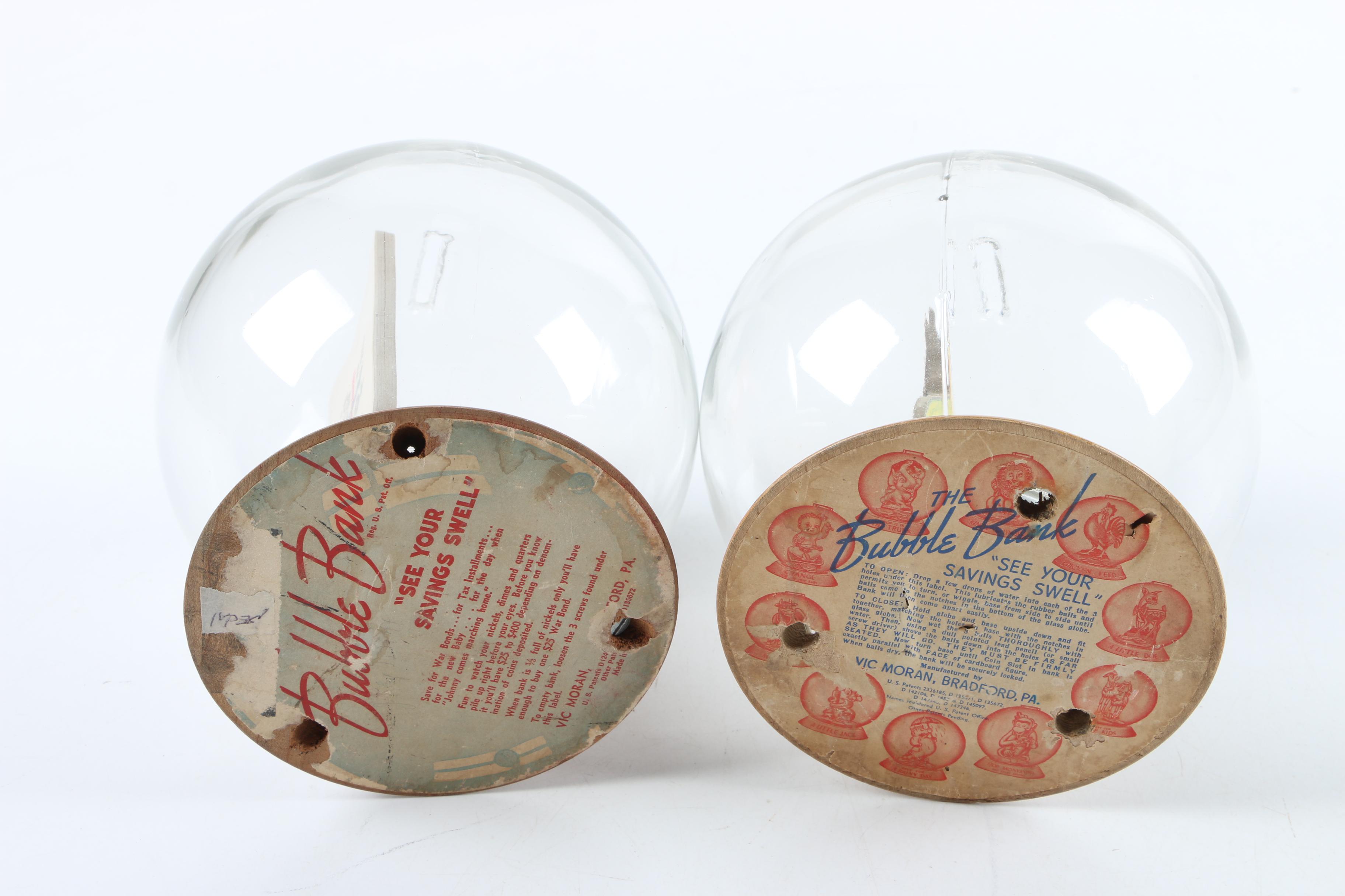 Vintage Glass Novelty Bubble Banks "Monark Pedal Power" and "A Rainy Day"