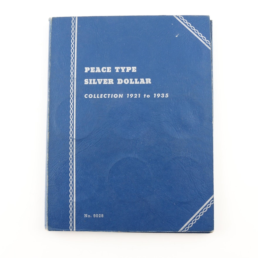 Group of 24 Silver Peace Dollars in a Whitman Folder