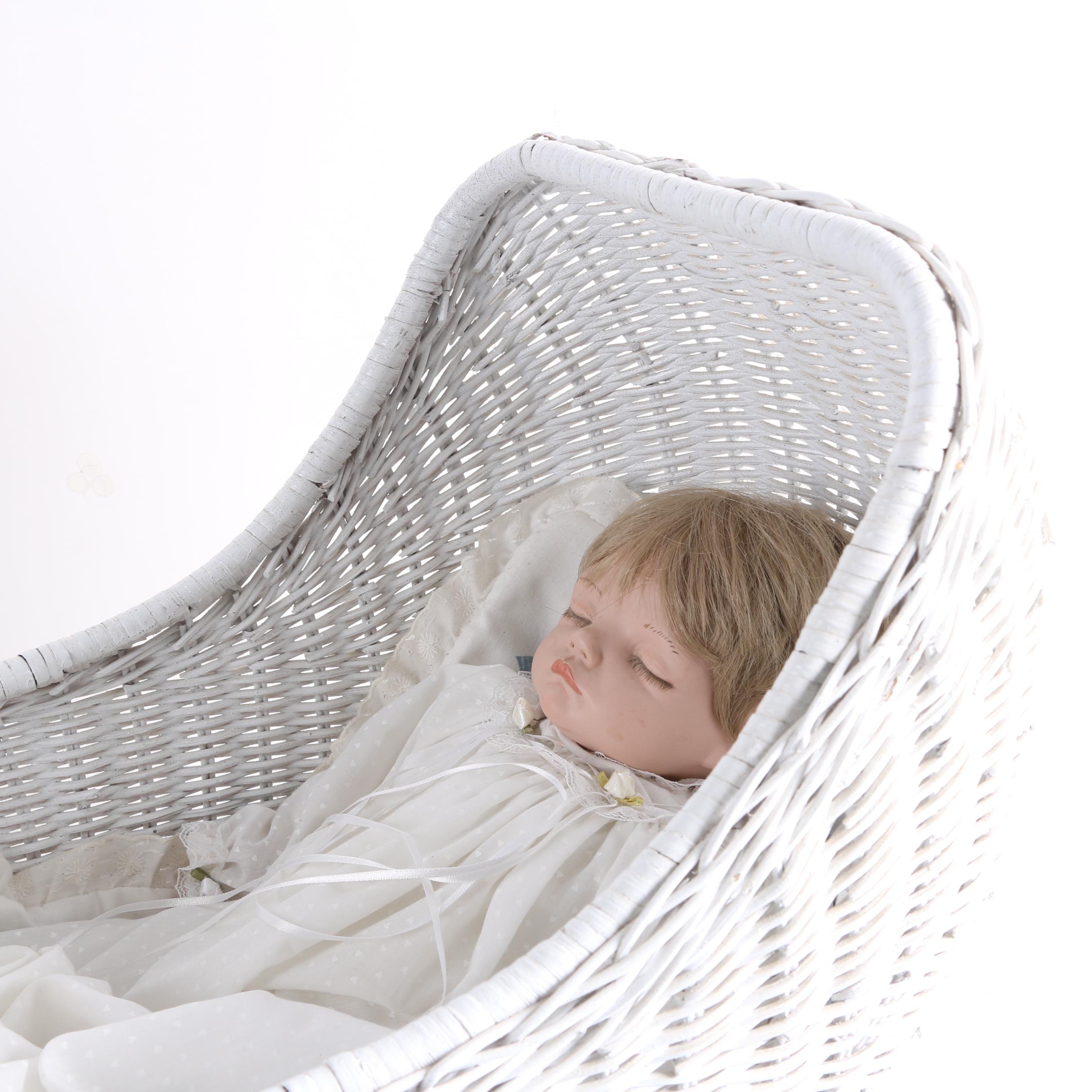 Porcelain Baby Doll in White Wicker Pram
