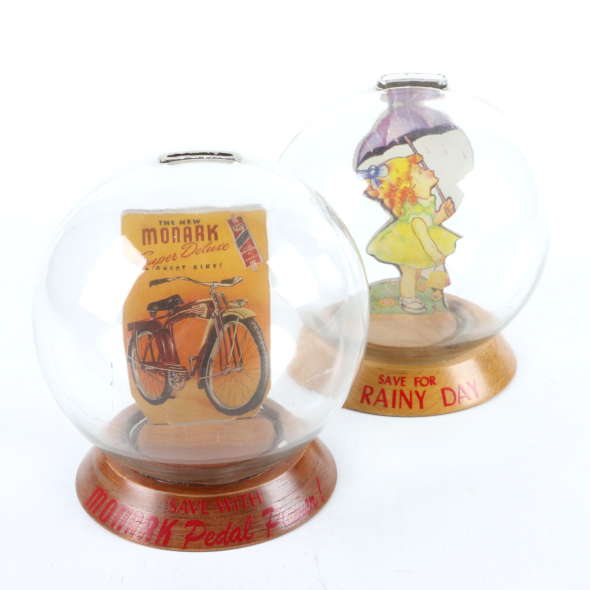 Vintage Glass Novelty Bubble Banks "Monark Pedal Power" and "A Rainy Day"