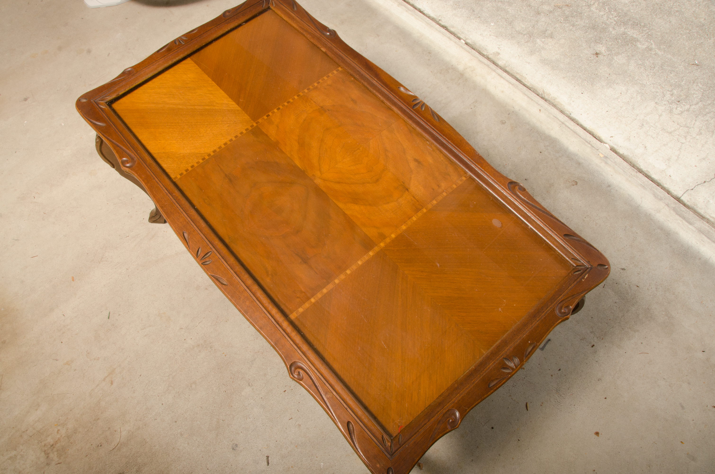 Carved Wooden Coffee Table with Inlaid Glass Top