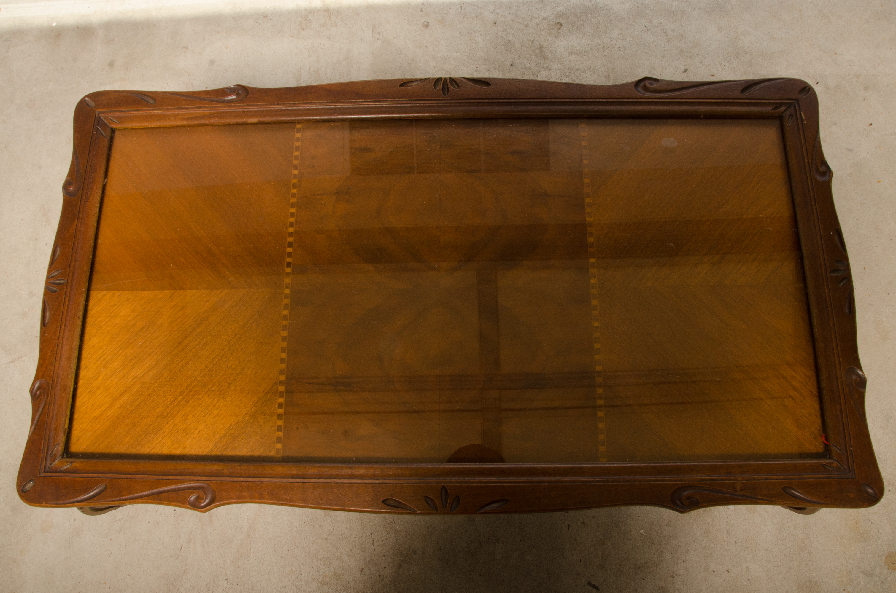 Carved Wooden Coffee Table with Inlaid Glass Top