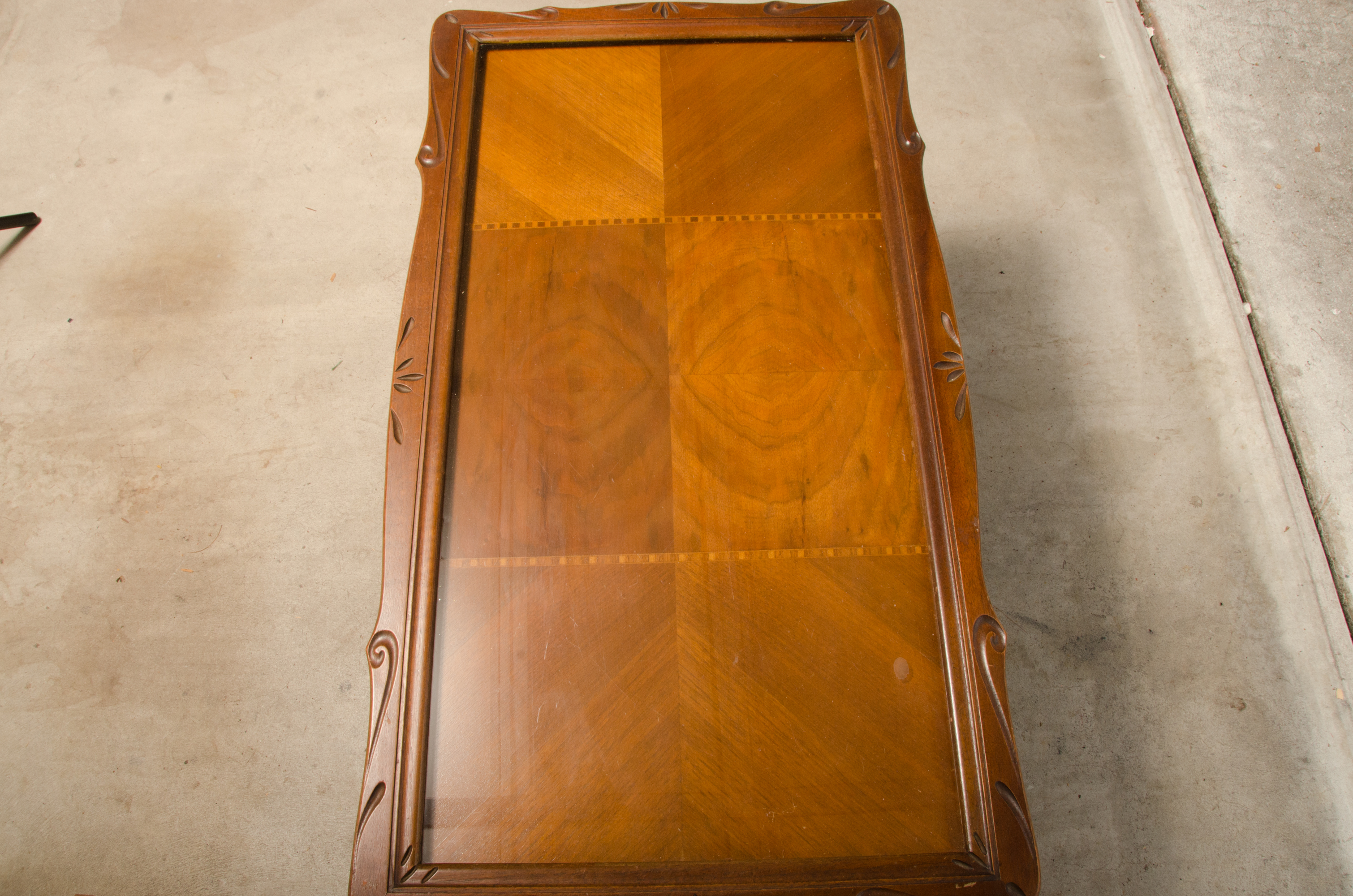 Carved Wooden Coffee Table with Inlaid Glass Top