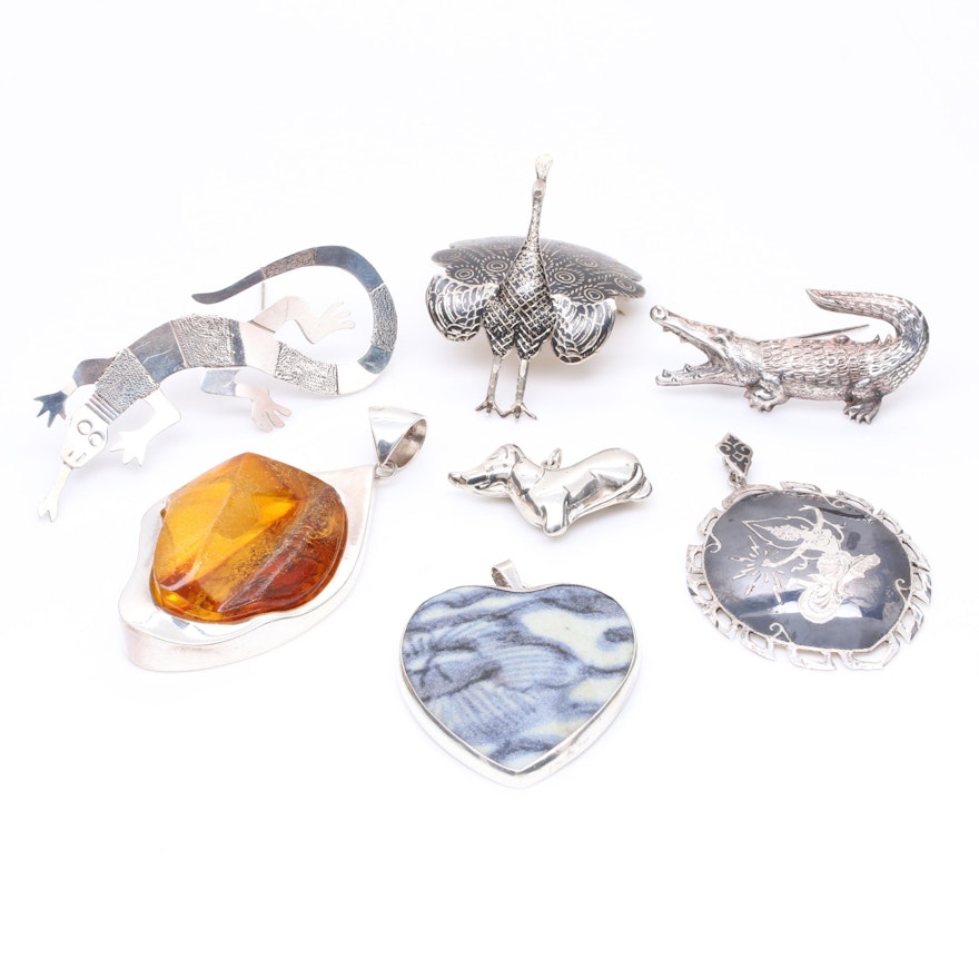 Sterling Silver Jewelry Assortment Including Pottery and Thai Sterling