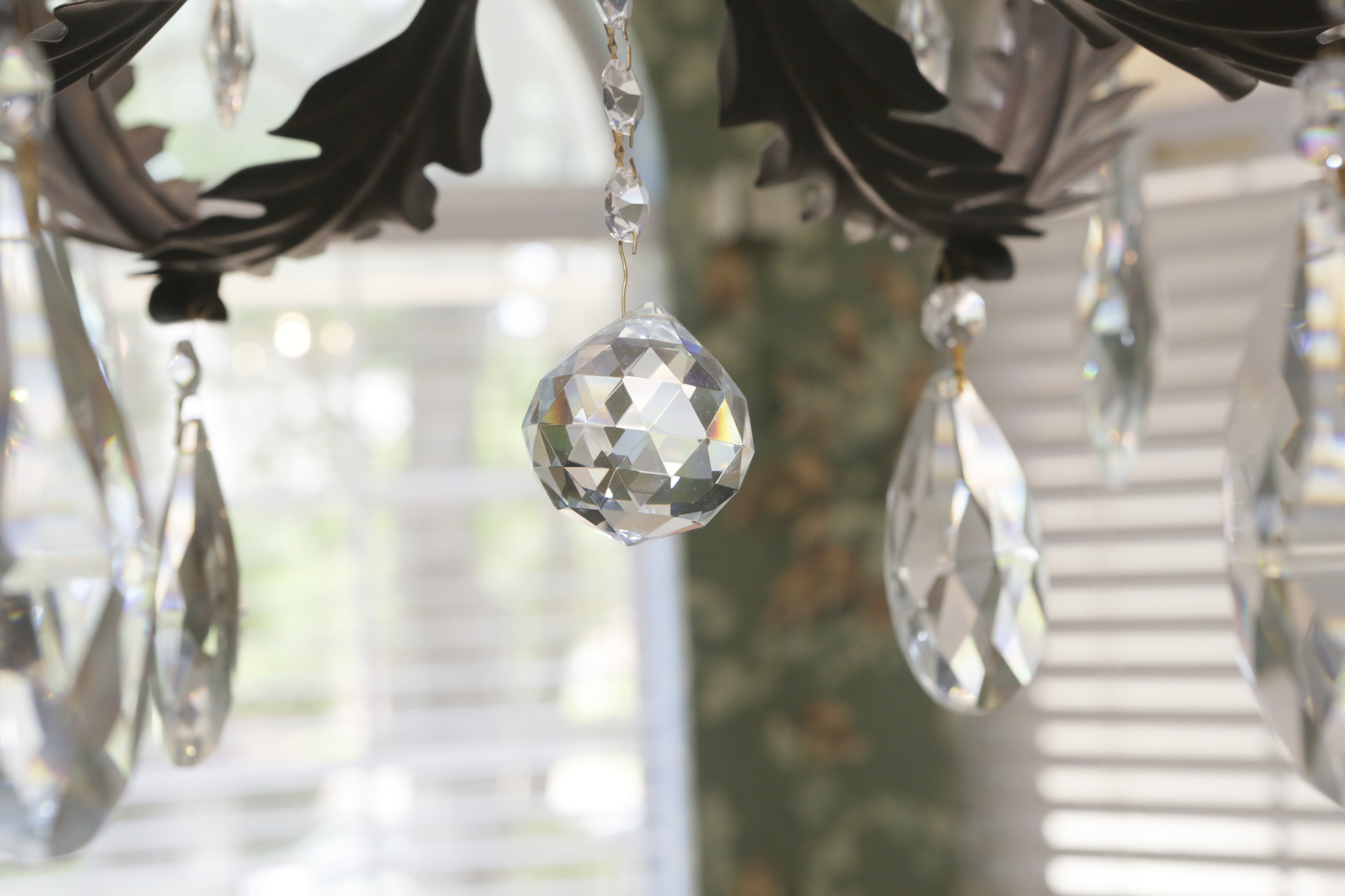 Patinaed Metal and Crystal Six Light Chandelier