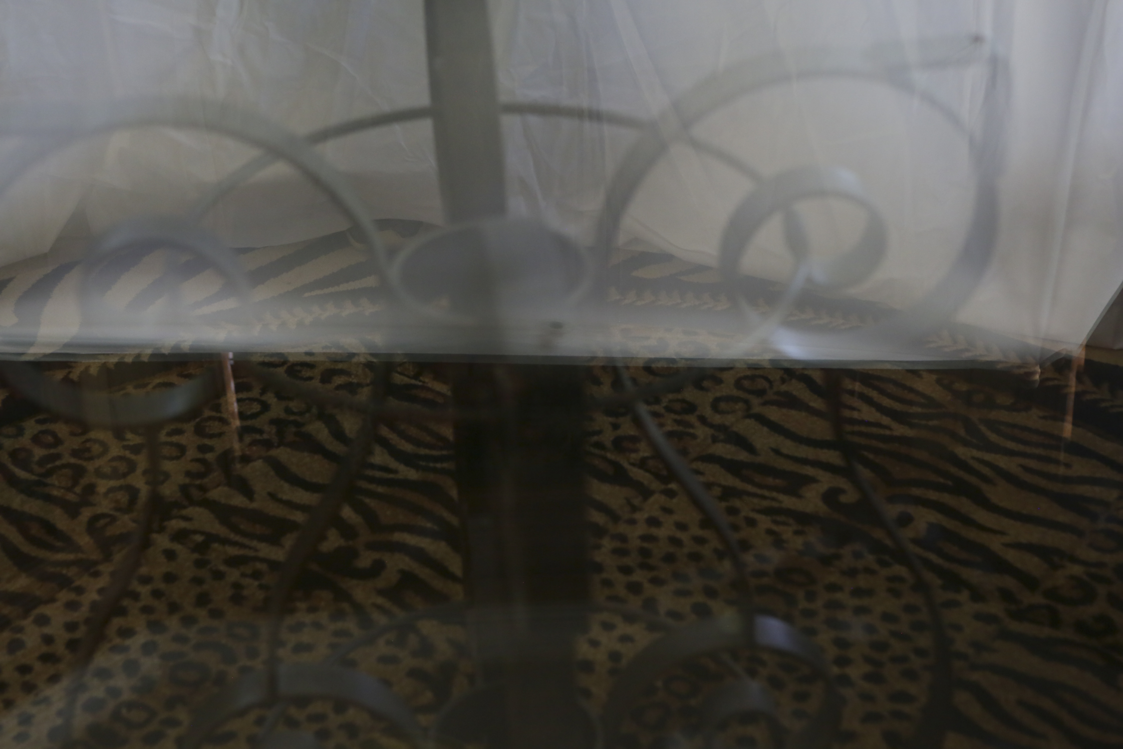 Glass Dining Table with Scrolling Metal Base