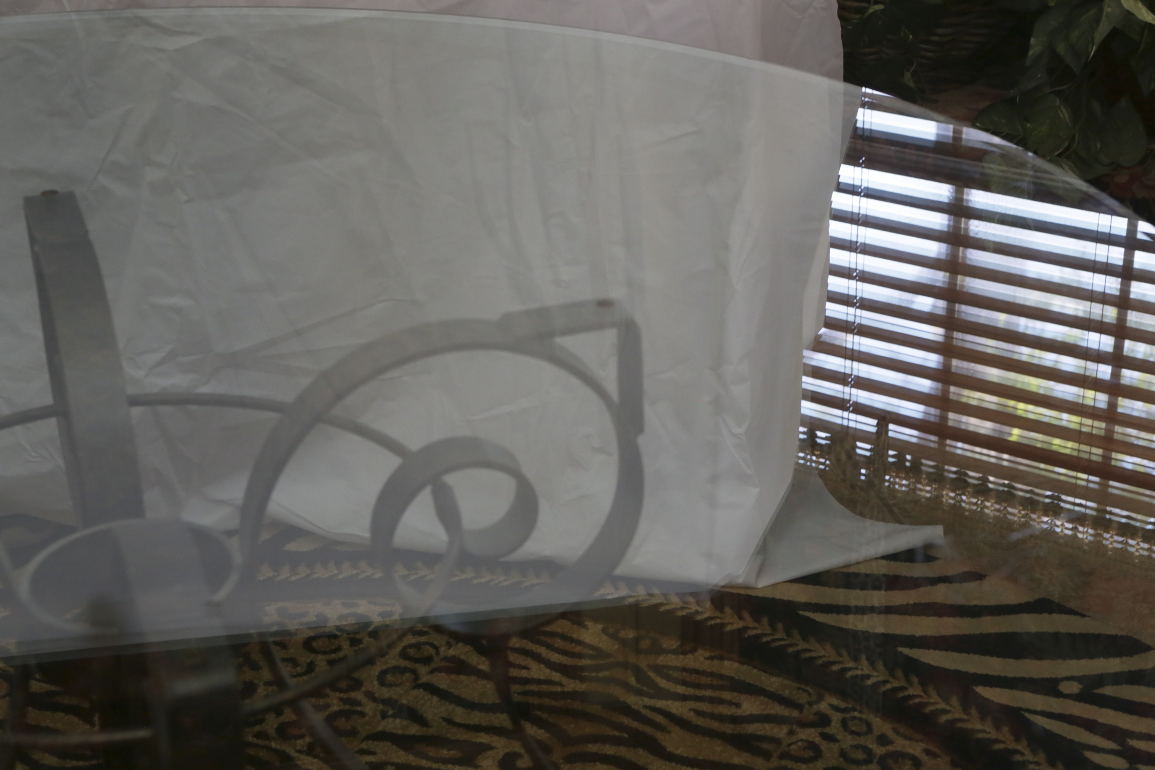 Glass Dining Table with Scrolling Metal Base