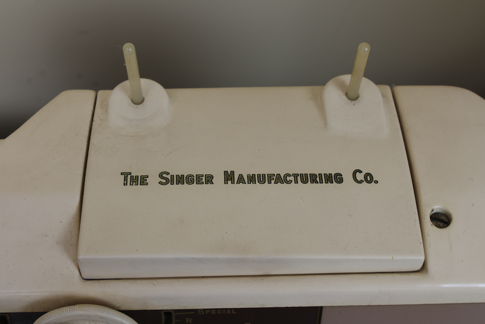 Art Deco Era Sewing Machine Table with a Pink Singer 401 A Machine