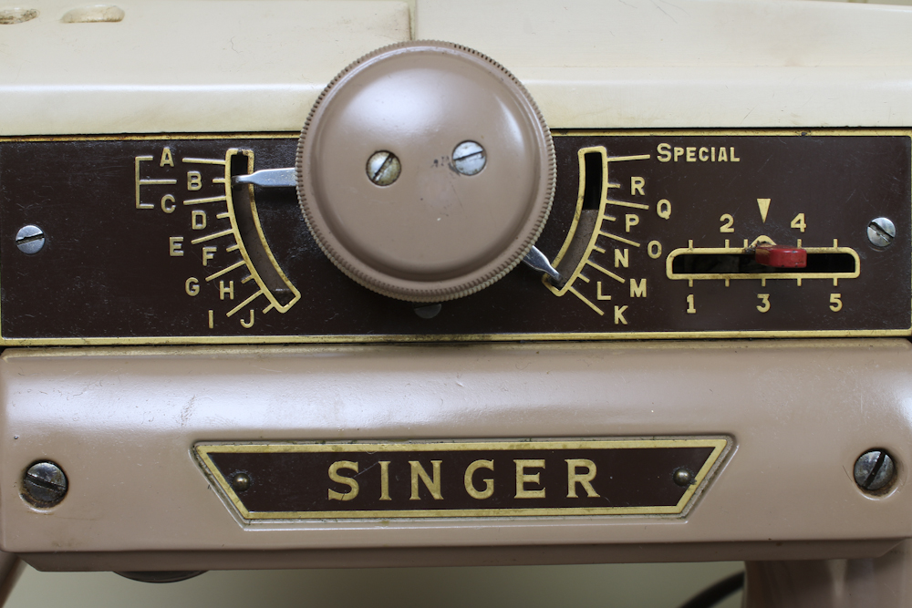 Art Deco Era Sewing Machine Table with a Pink Singer 401 A Machine