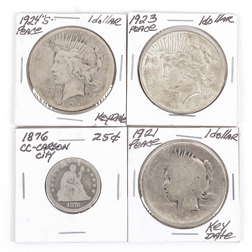 Three Peace Silver Dollars and a Liberty Seated Silver Quarter