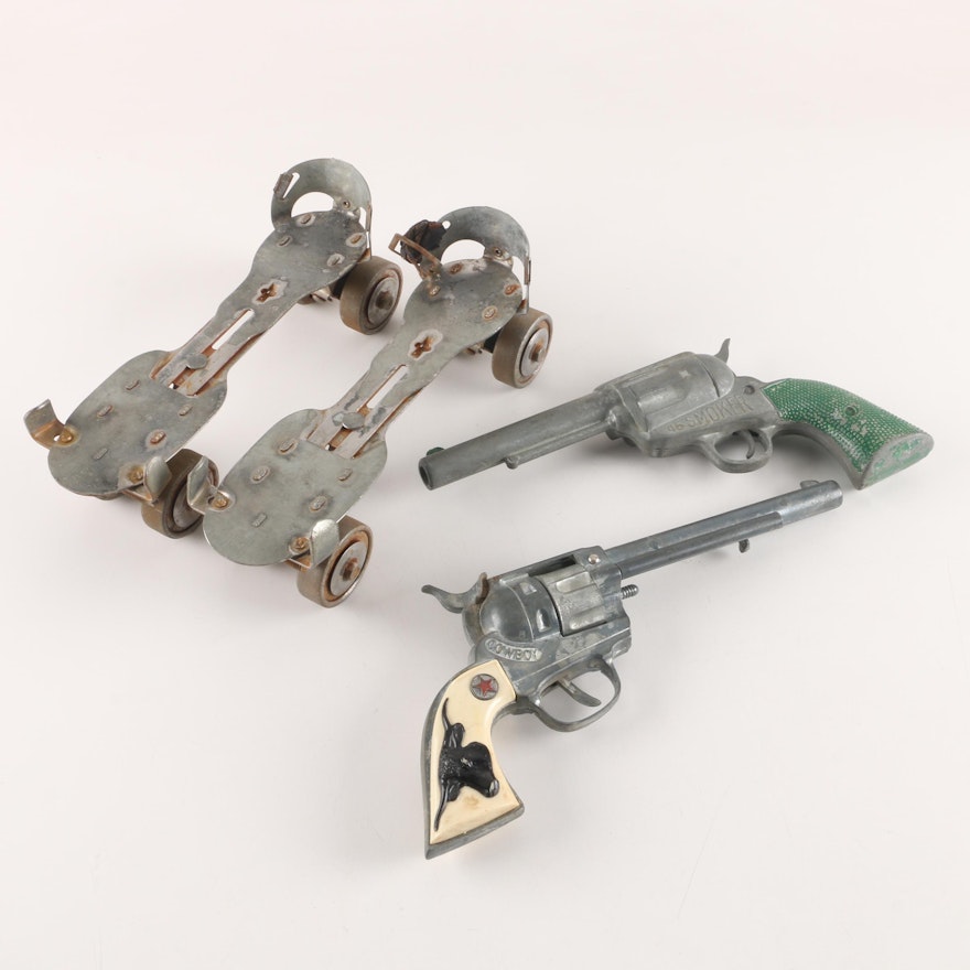 Vintage Roller Skates and Toy Revolvers Including Hubley