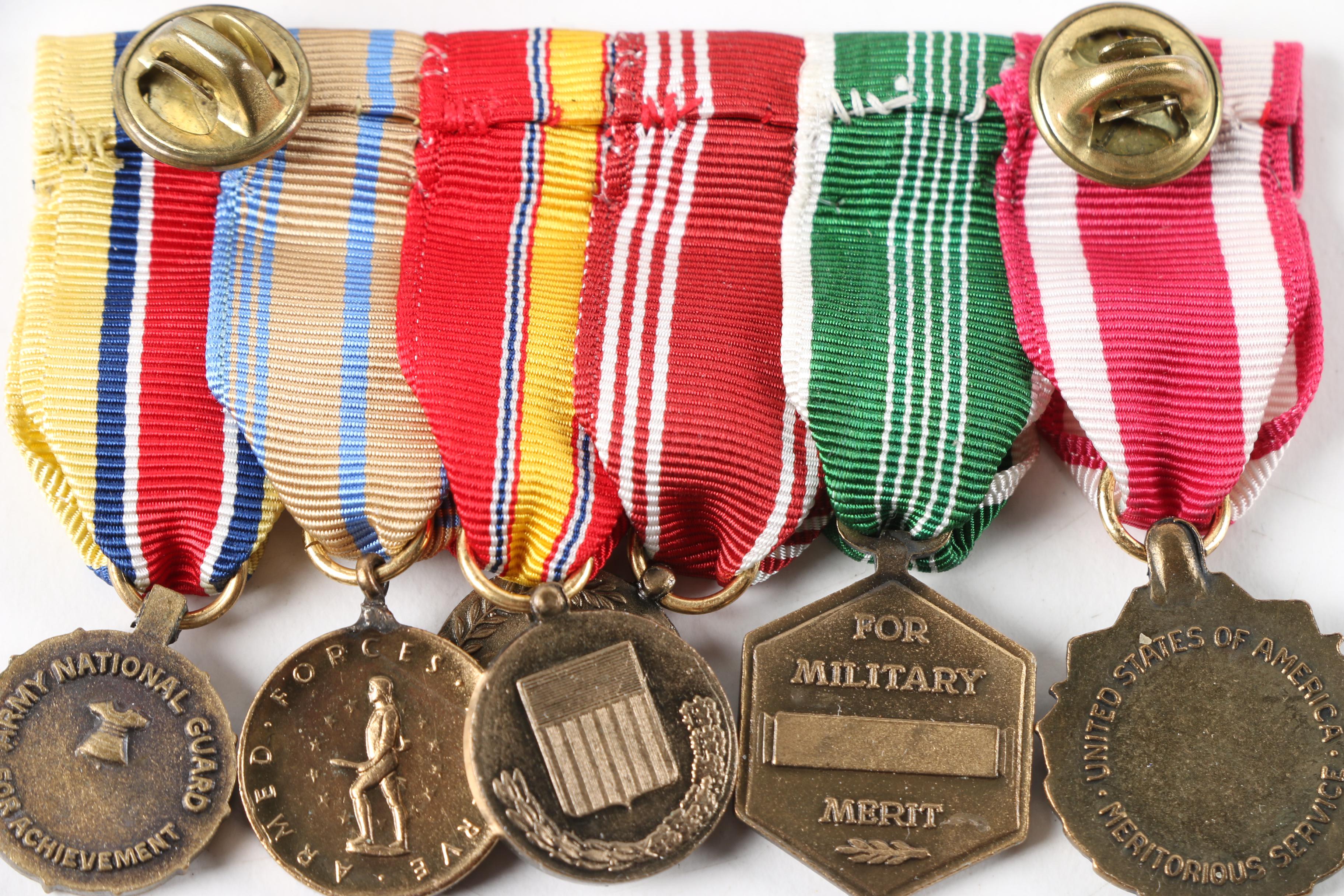 World War II Era War Ration Books with Medals, Patches, and Pins