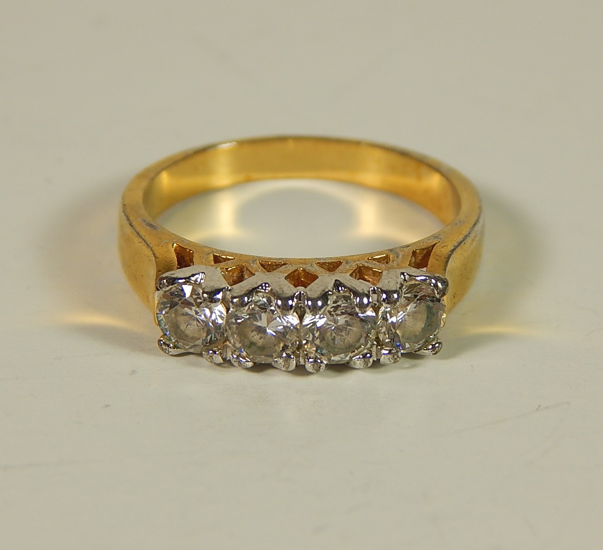 Four Sterling Silver Gold-Tone Rings with Stones