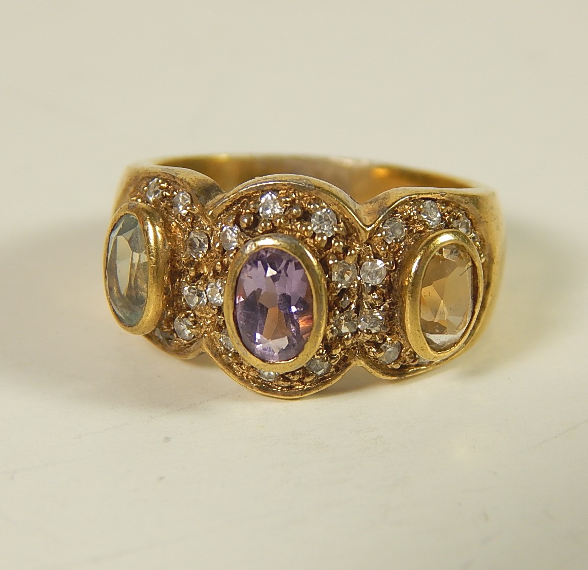 Four Sterling Silver Gold-Tone Rings with Stones