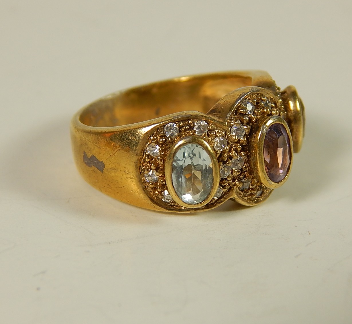 Four Sterling Silver Gold-Tone Rings with Stones