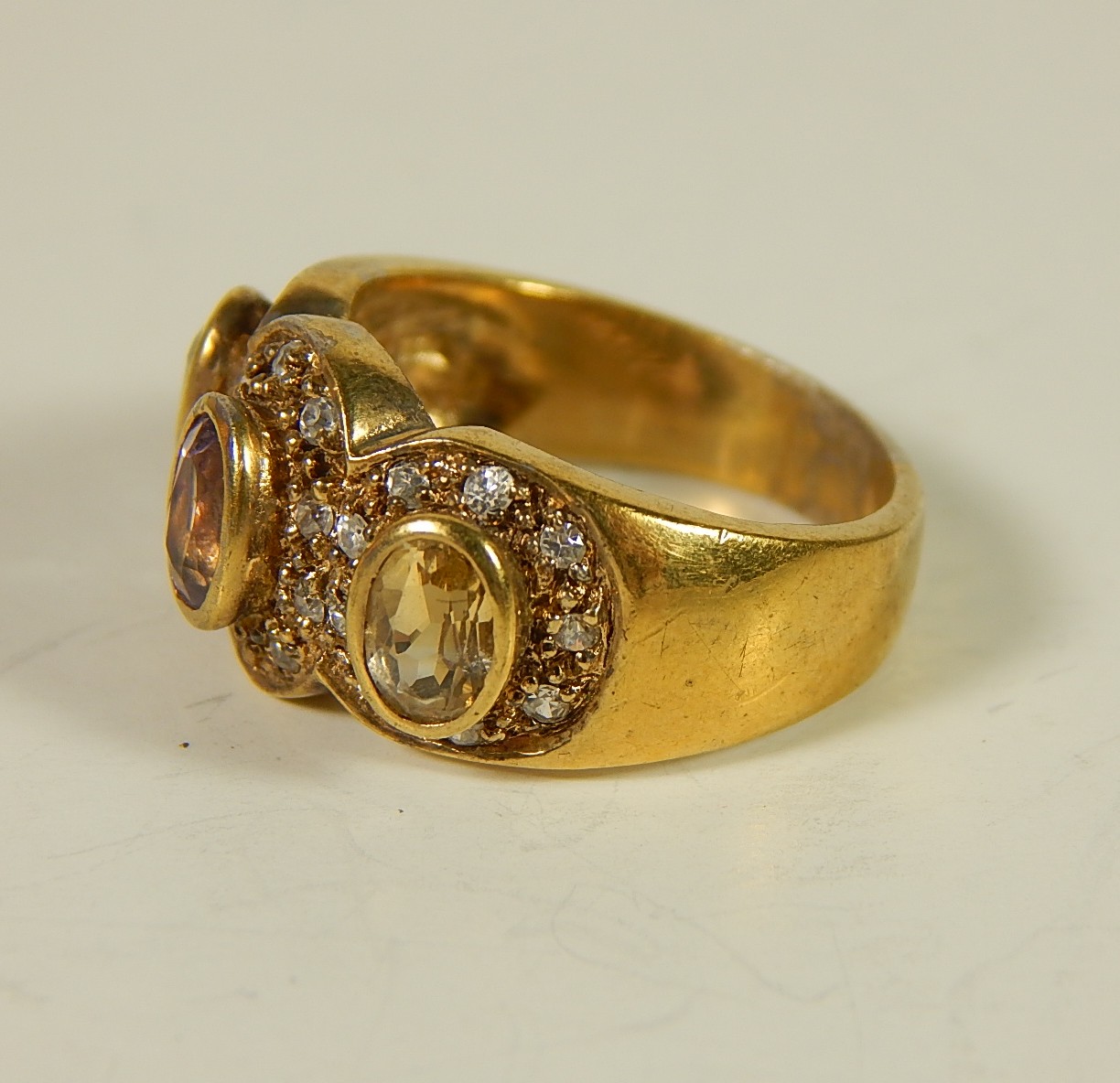 Four Sterling Silver Gold-Tone Rings with Stones