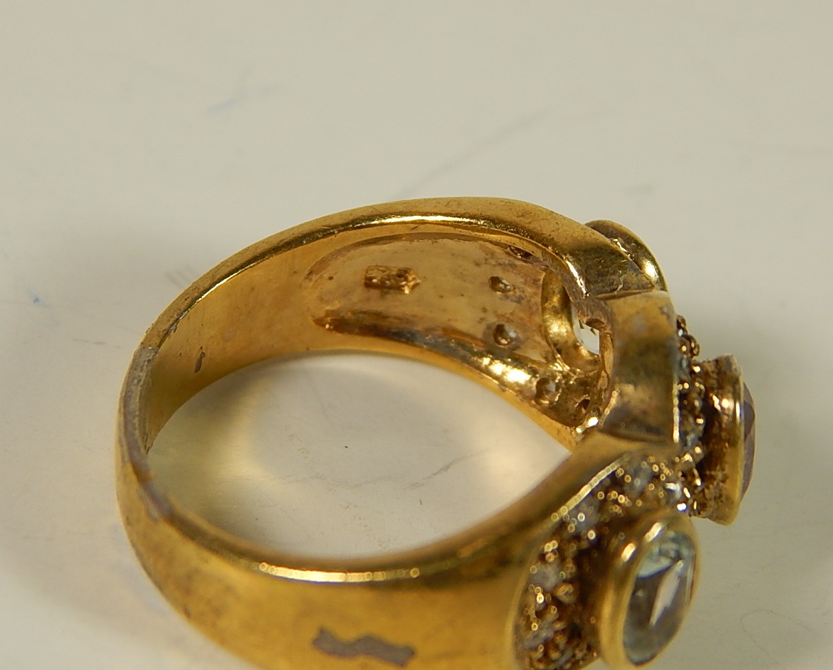 Four Sterling Silver Gold-Tone Rings with Stones