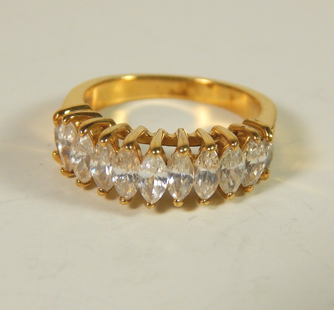 Four Sterling Silver Gold-Tone Rings with Stones