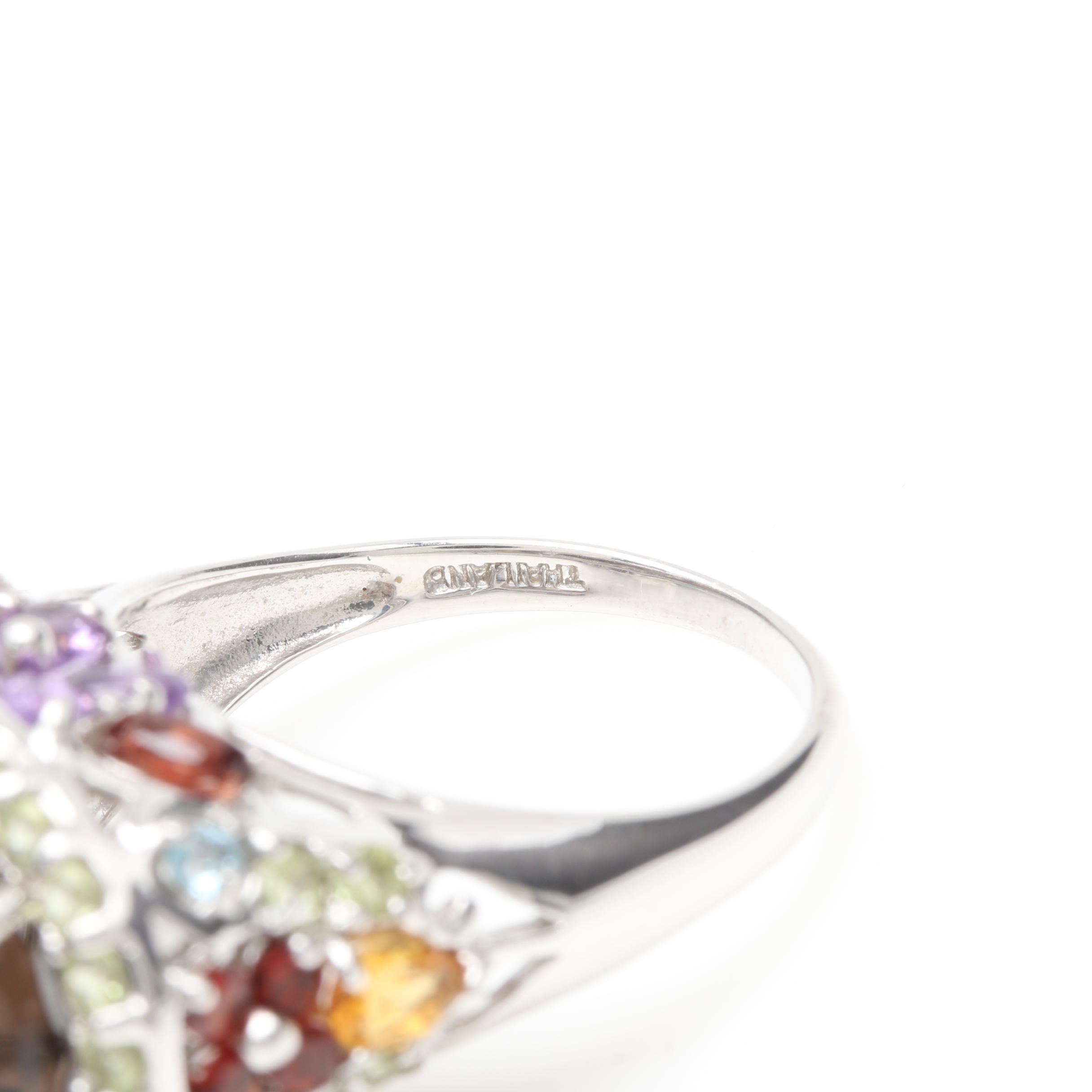 Silver Tone Bracelet and Sterling Silver Rings Including Garnet and Peridot