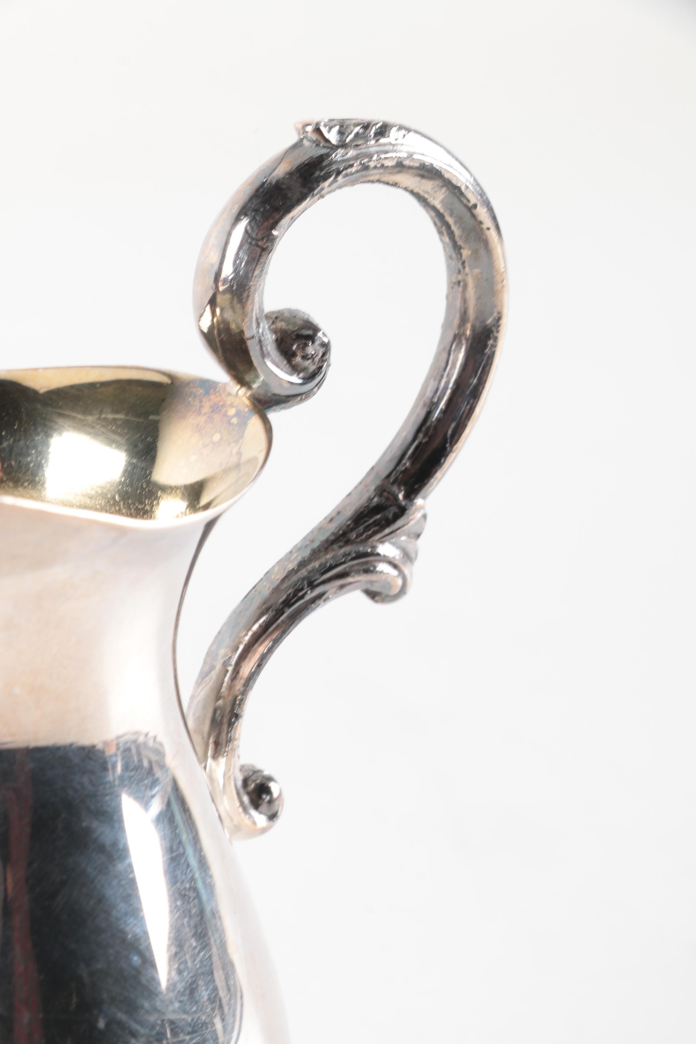 New Amsterdam Silver Co. Pitcher and Other Silver Plate Serveware