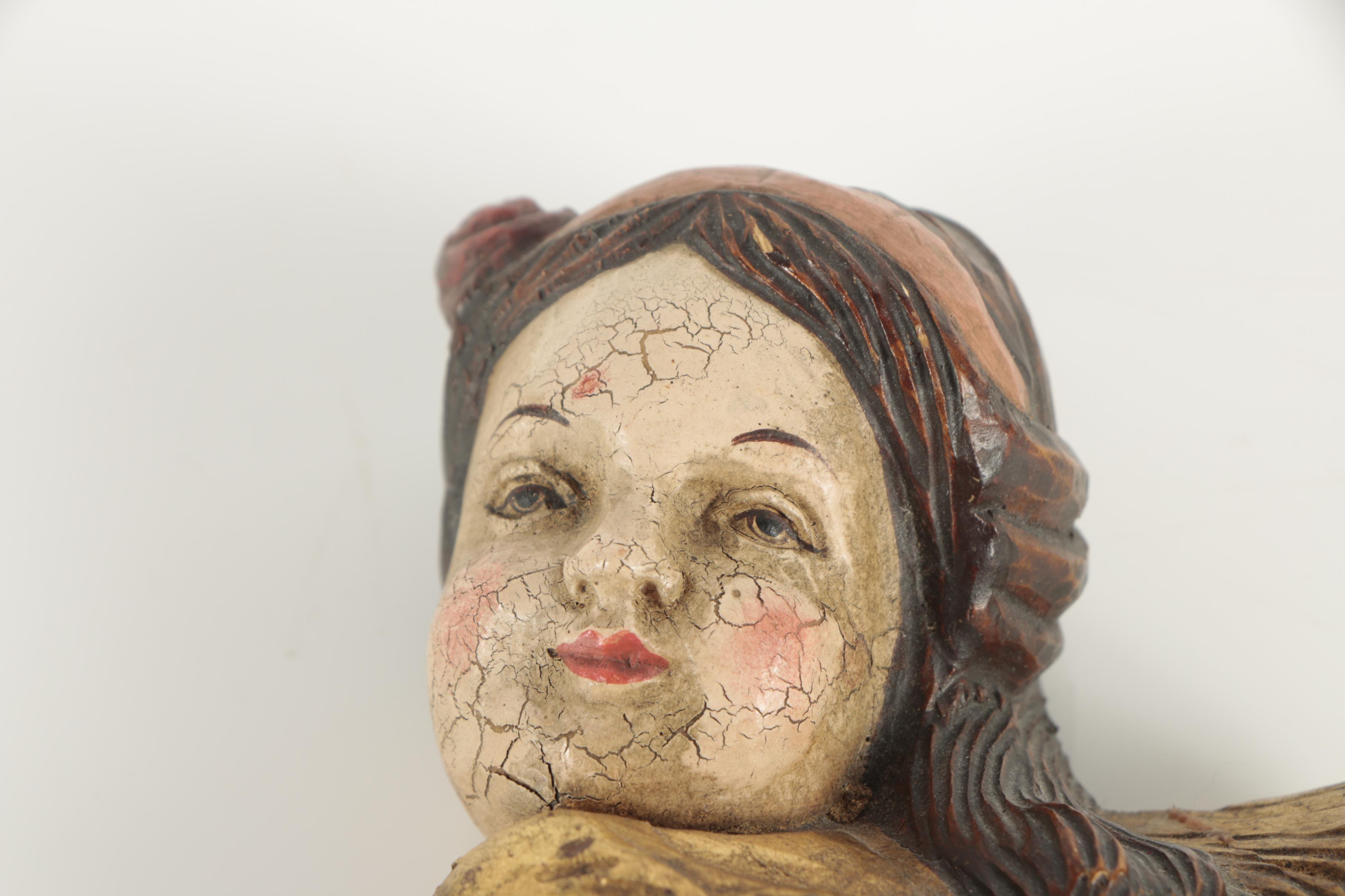 Carved Wood Angel Faces