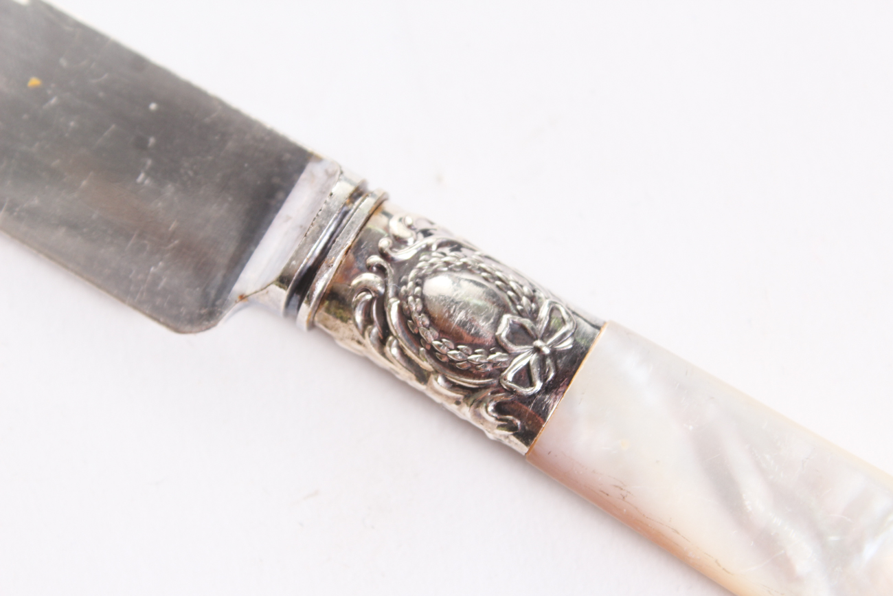 Holmes & Edwards Mother-of-Pearl Handle and Sterling Silver Bolster Knives