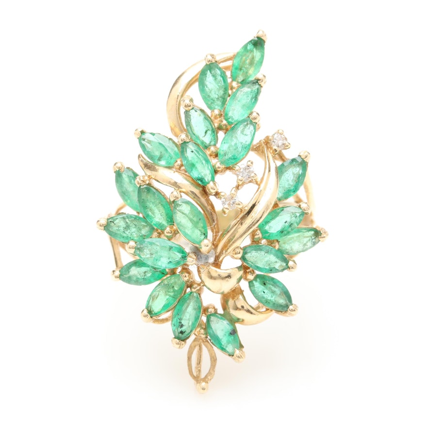 Circa 1950s - 1960s 14K Yellow Gold Emerald and Diamond Foliate Ring