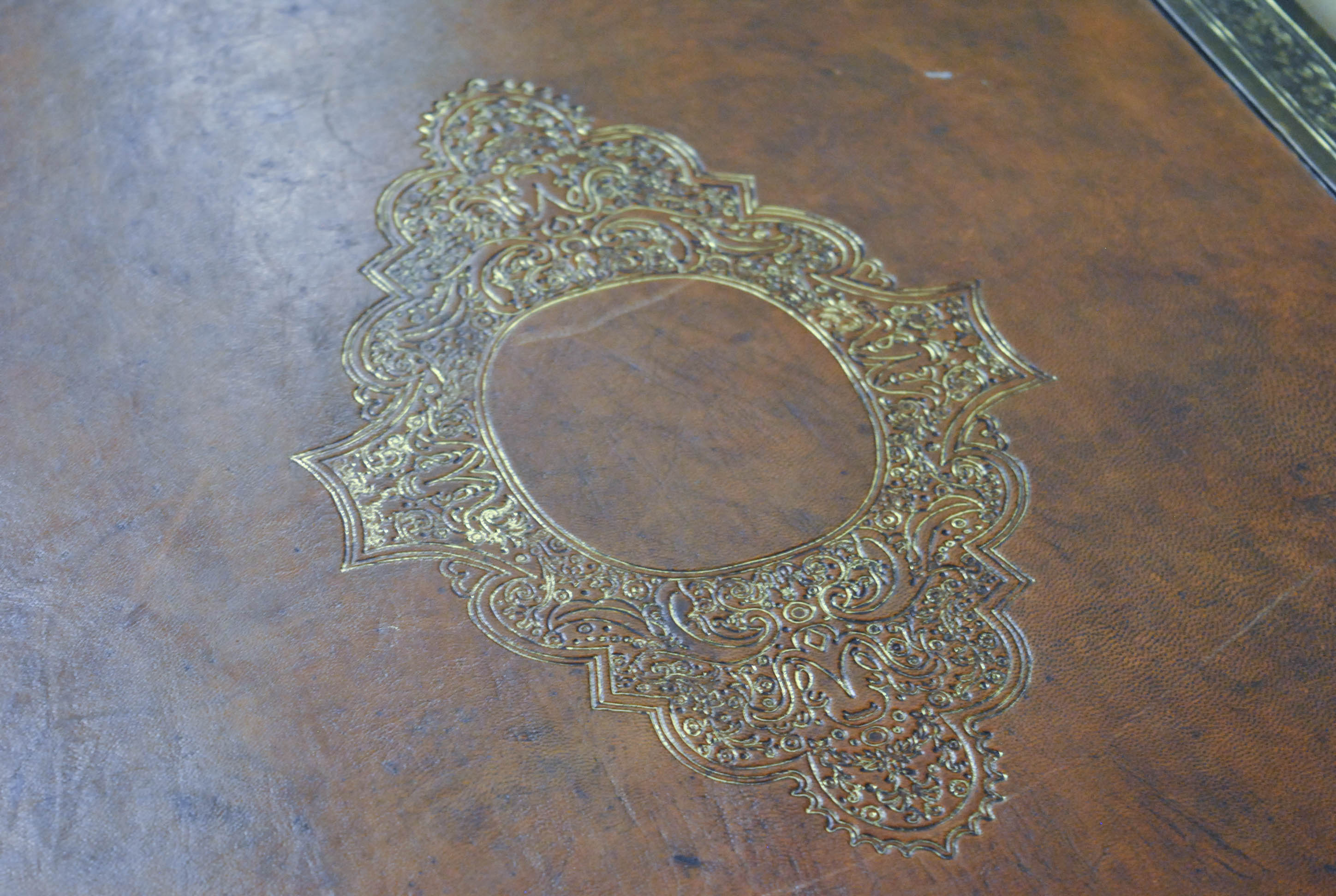 Vintage Wrought Iron Accent Table with Embossed Leather Top