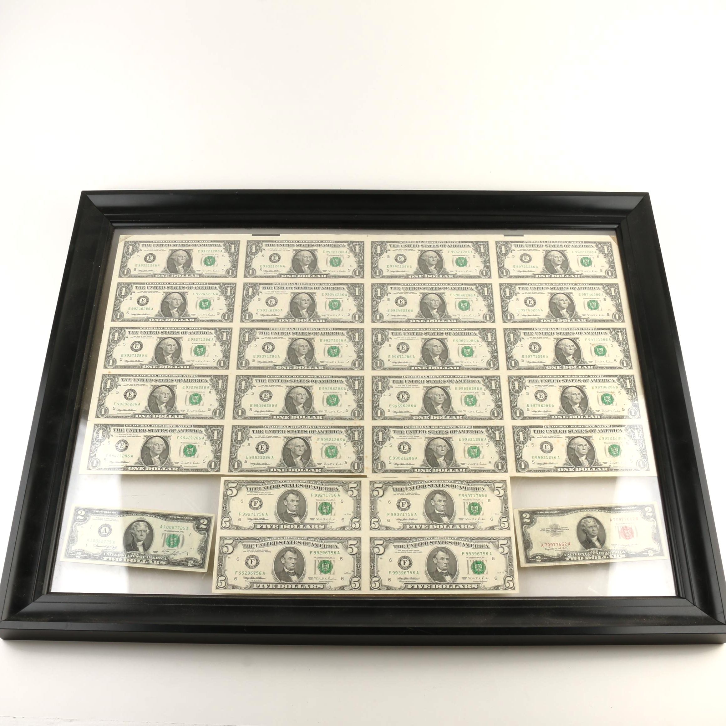 Group of Twenty-Six U.S. Currency Notes Including Uncut Sheet in a Frame