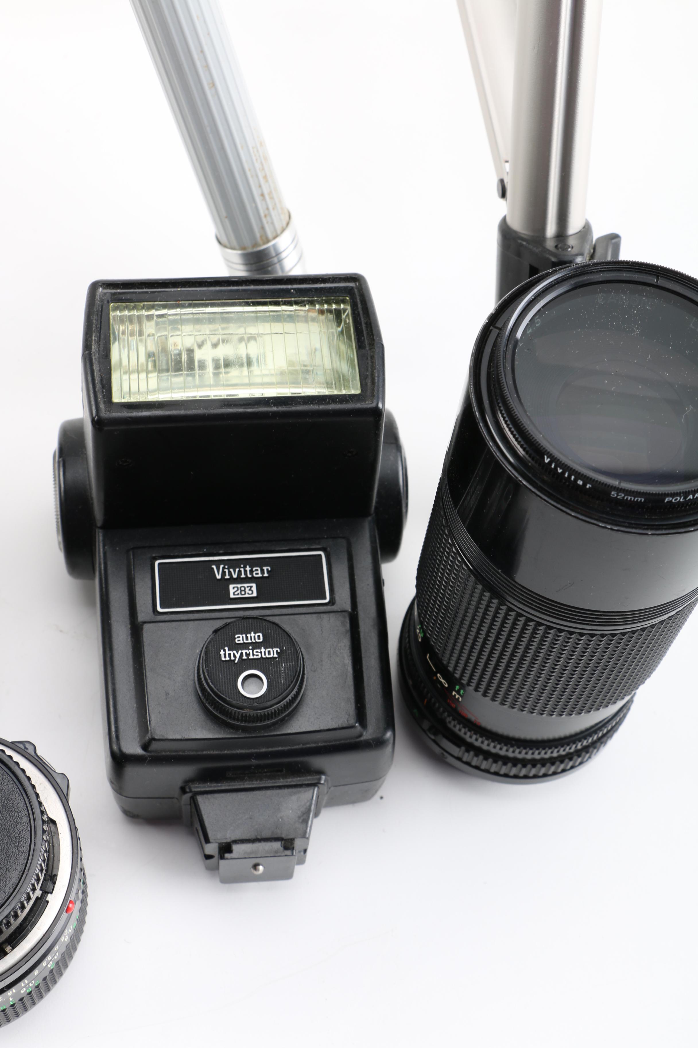 Vintage Canon AE-1 35mm SLR Camera with Tripods, Flash Unit, and Lenses