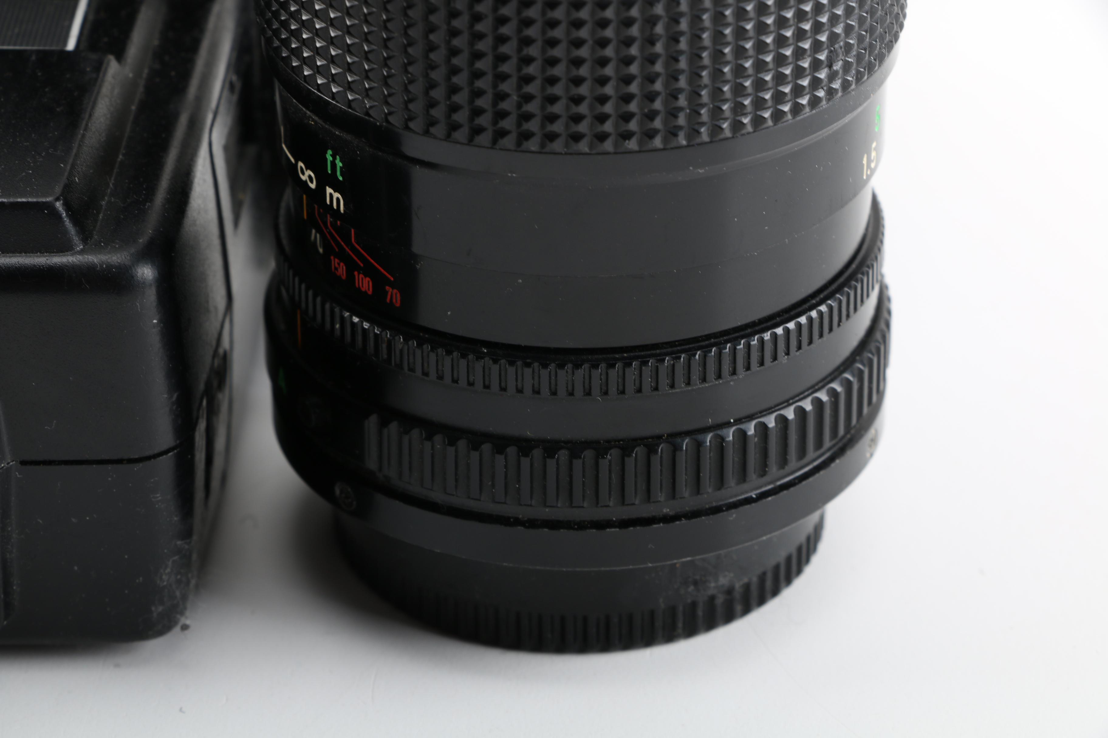 Vintage Canon AE-1 35mm SLR Camera with Tripods, Flash Unit, and Lenses