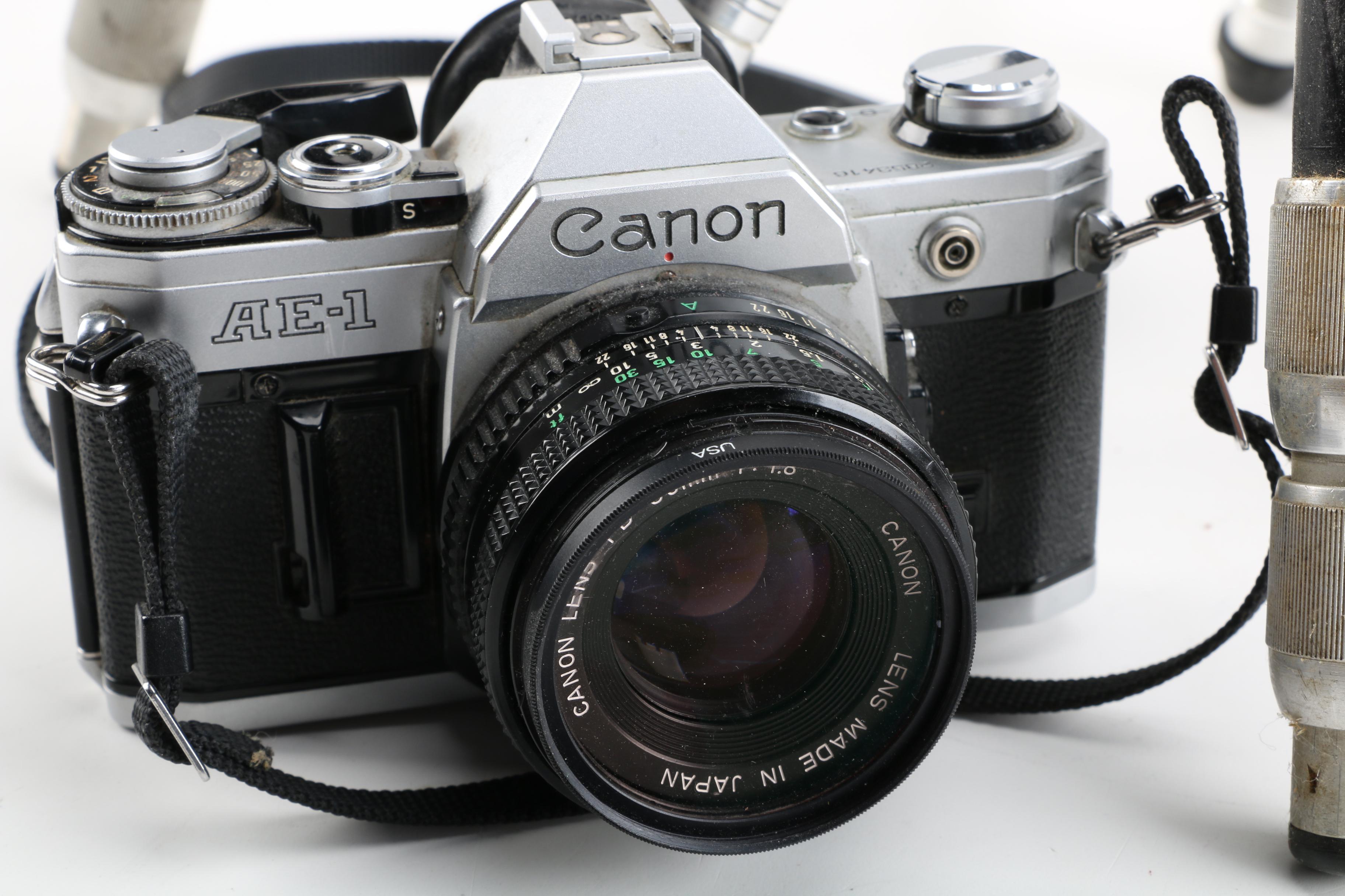 Vintage Canon AE-1 35mm SLR Camera with Tripods, Flash Unit, and Lenses