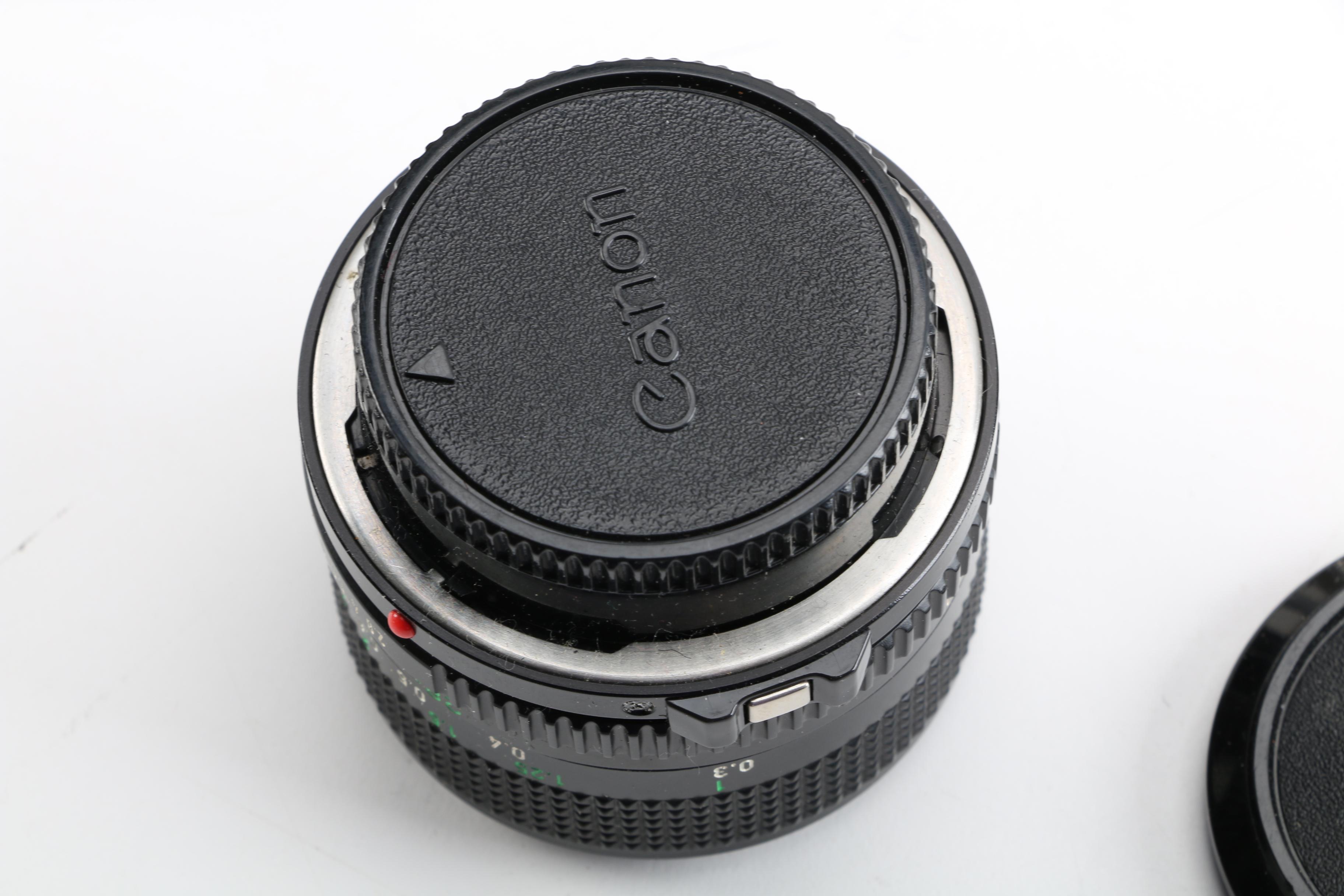 Vintage Canon AE-1 35mm SLR Camera with Tripods, Flash Unit, and Lenses