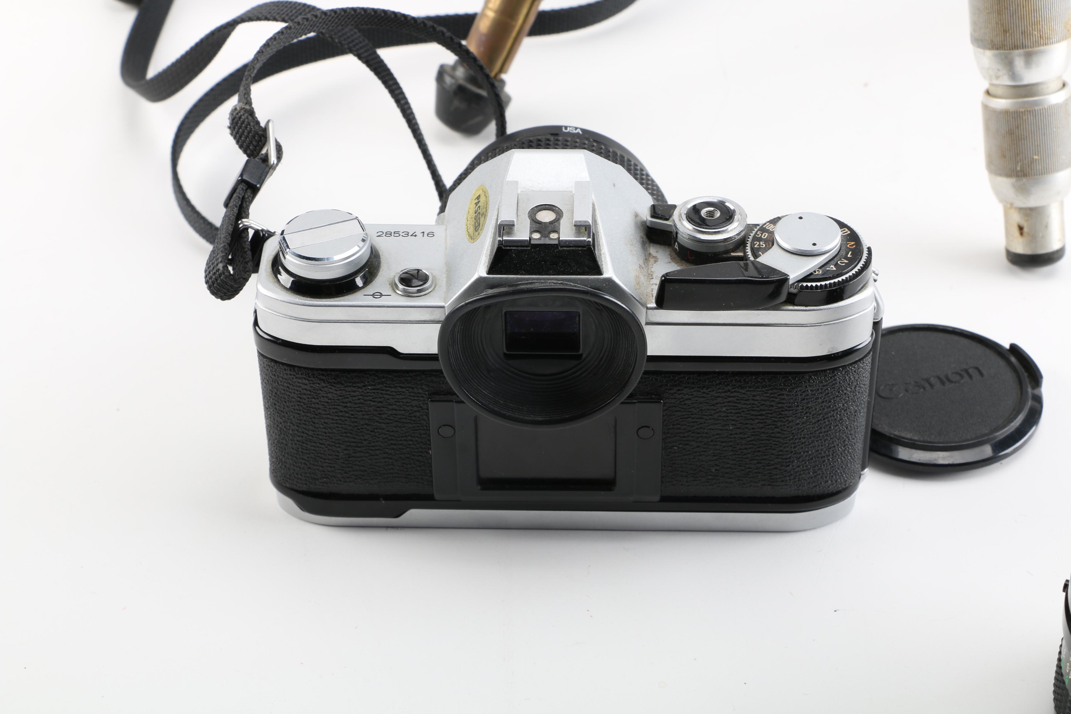 Vintage Canon AE-1 35mm SLR Camera with Tripods, Flash Unit, and Lenses