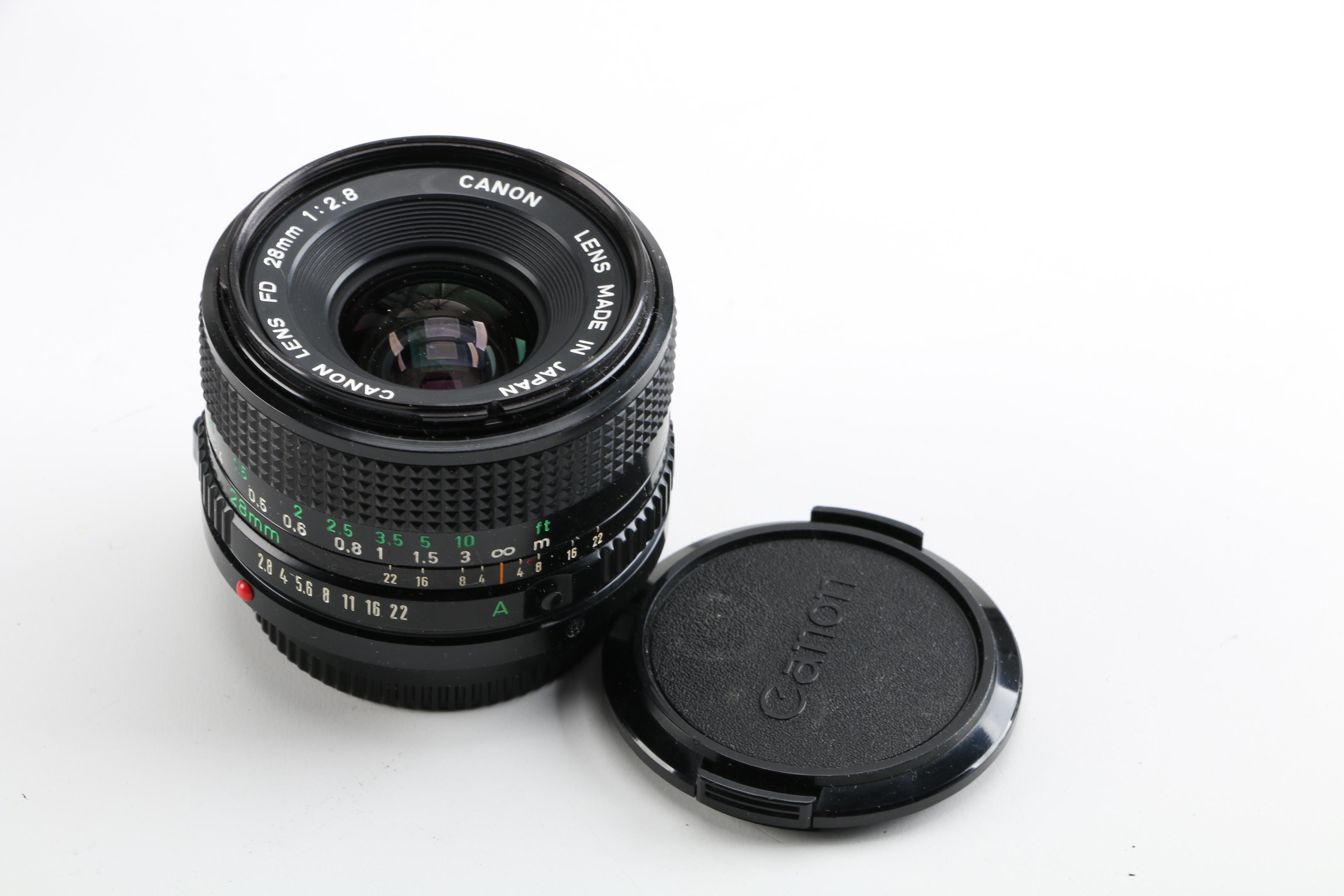 Vintage Canon AE-1 35mm SLR Camera with Tripods, Flash Unit, and Lenses