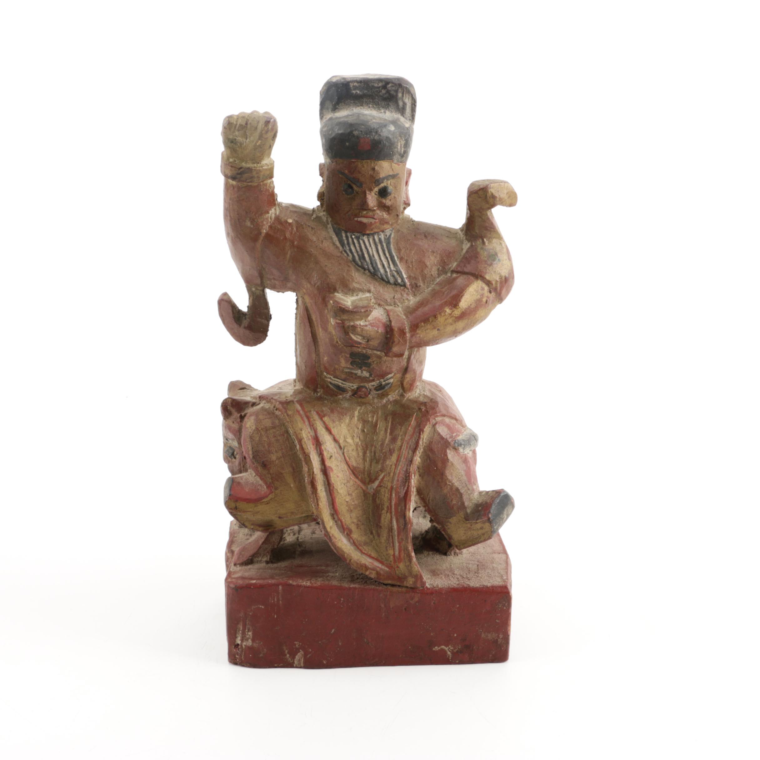 Wooden Figurine of Man Seated on Stylized Animal