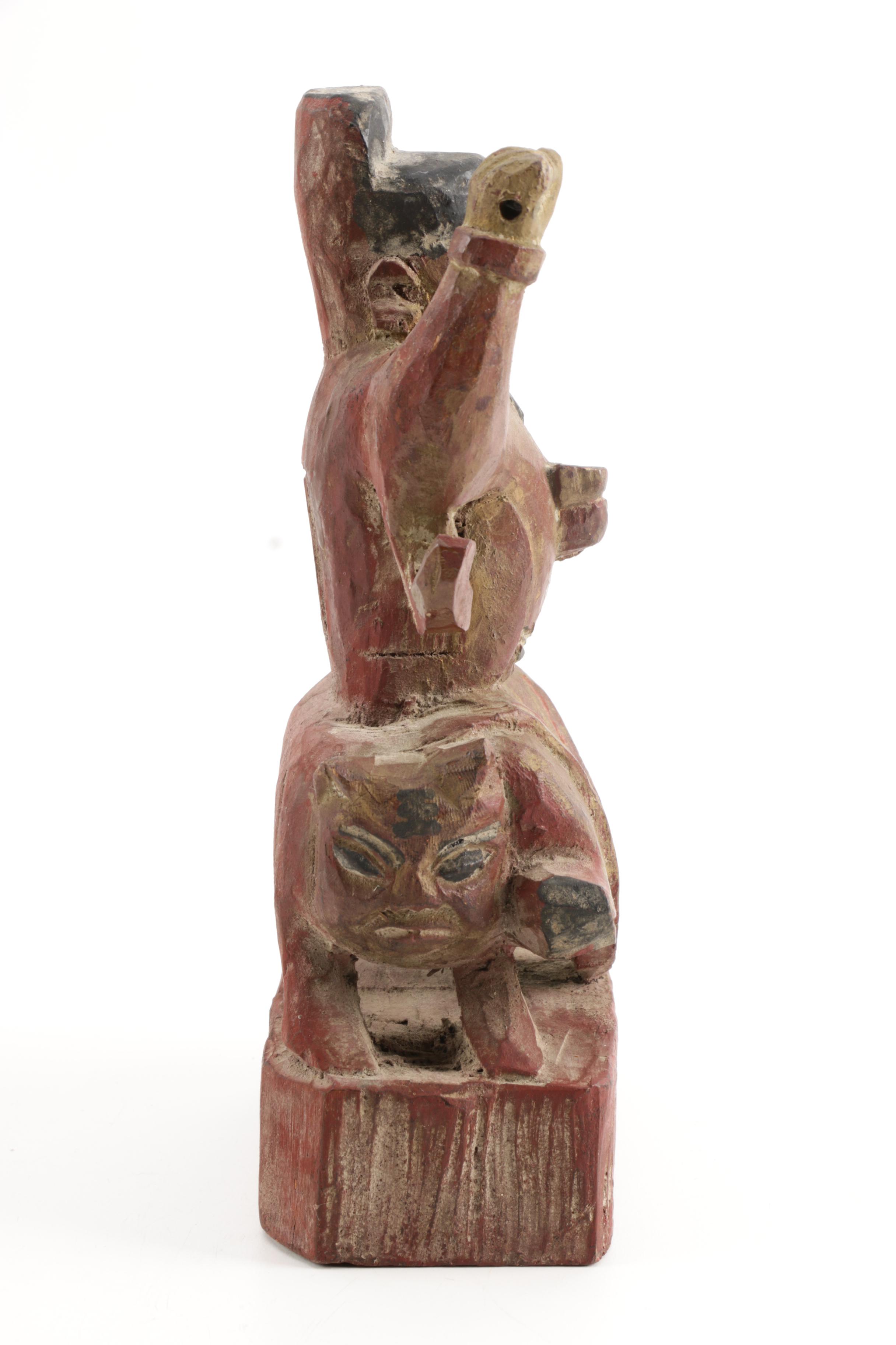 Wooden Figurine of Man Seated on Stylized Animal