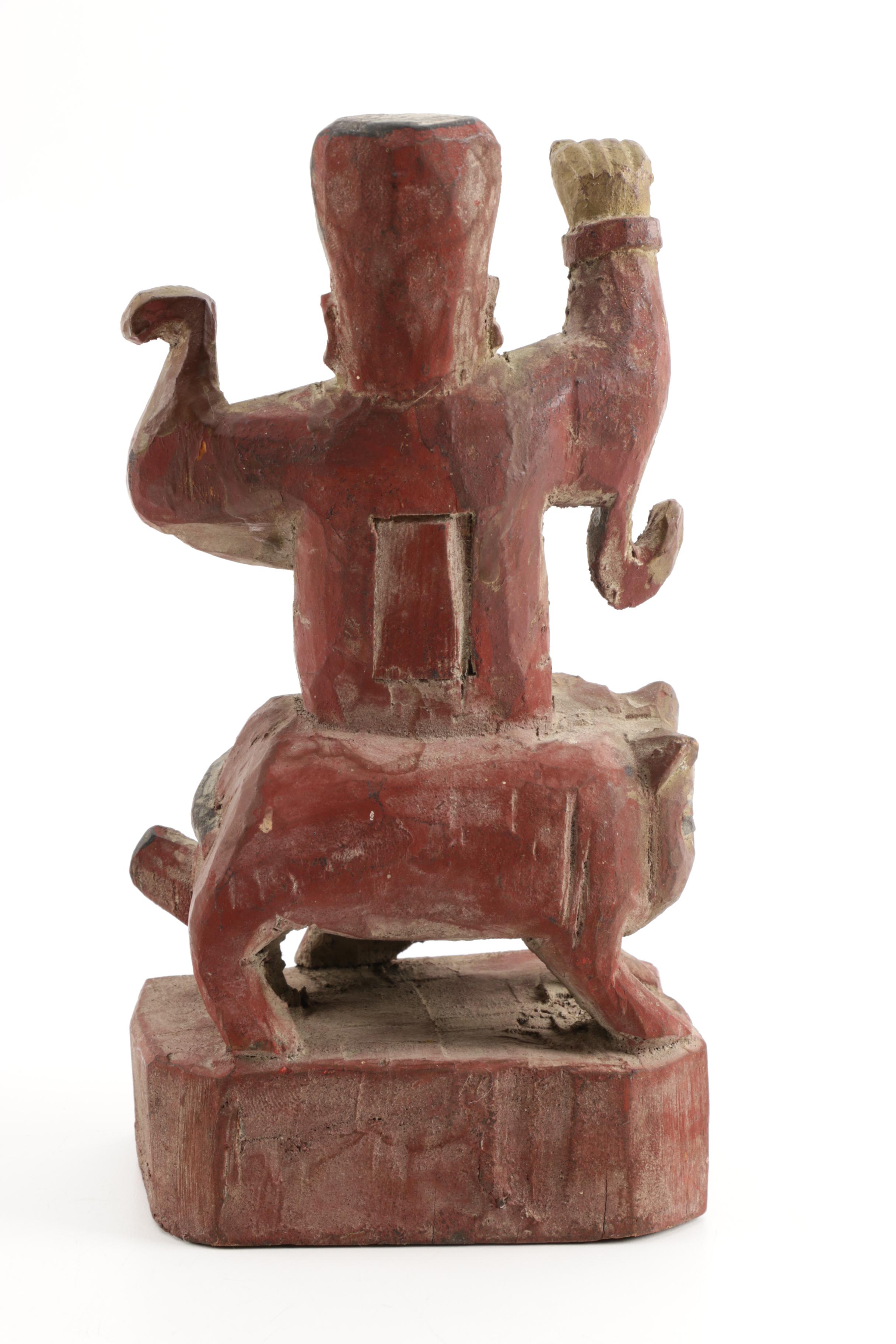 Wooden Figurine of Man Seated on Stylized Animal