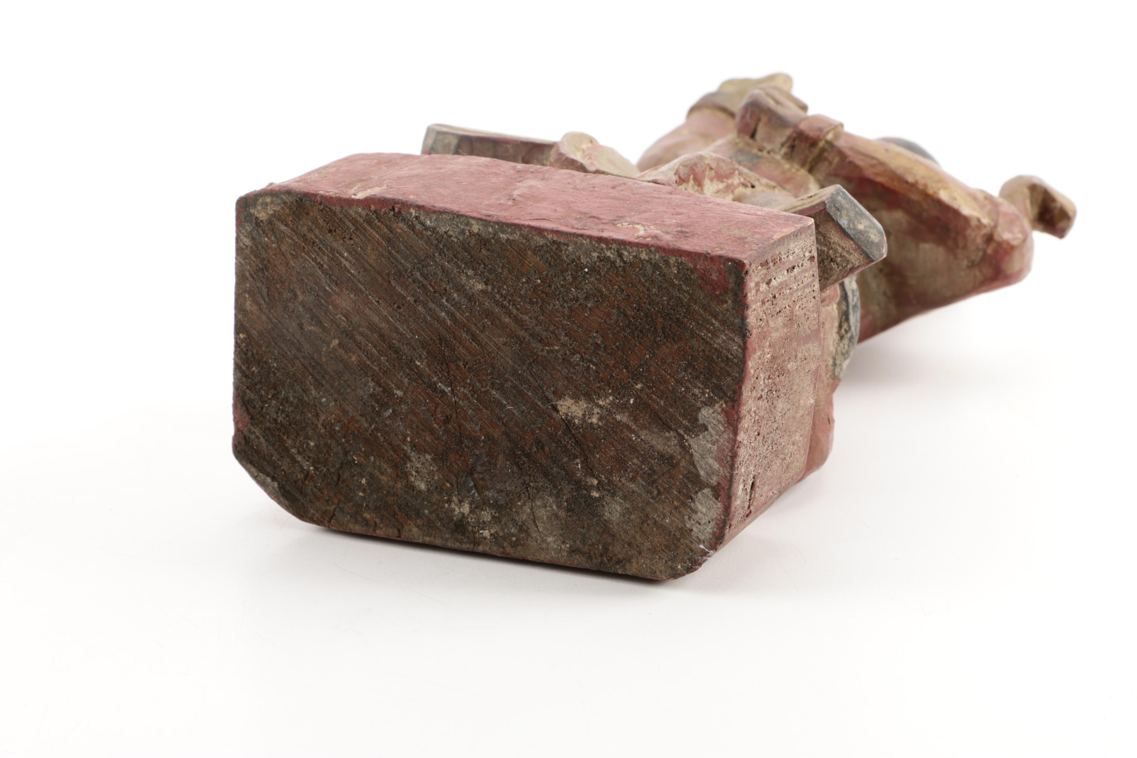 Wooden Figurine of Man Seated on Stylized Animal