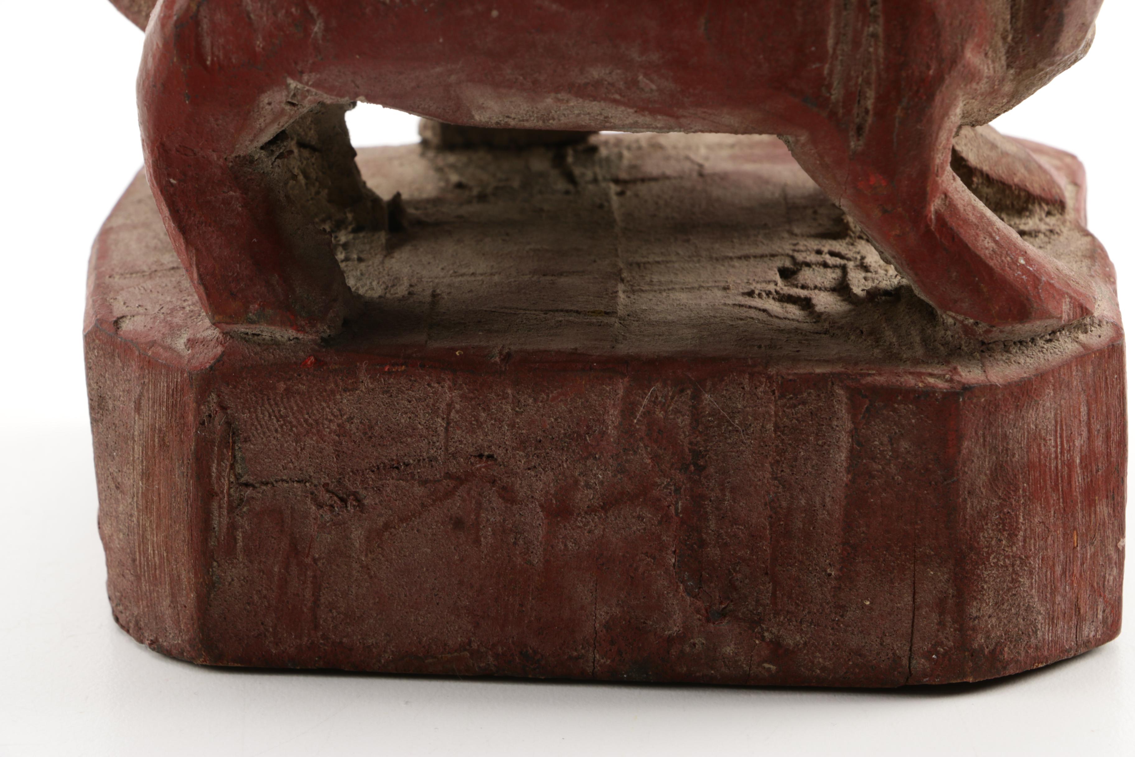 Wooden Figurine of Man Seated on Stylized Animal