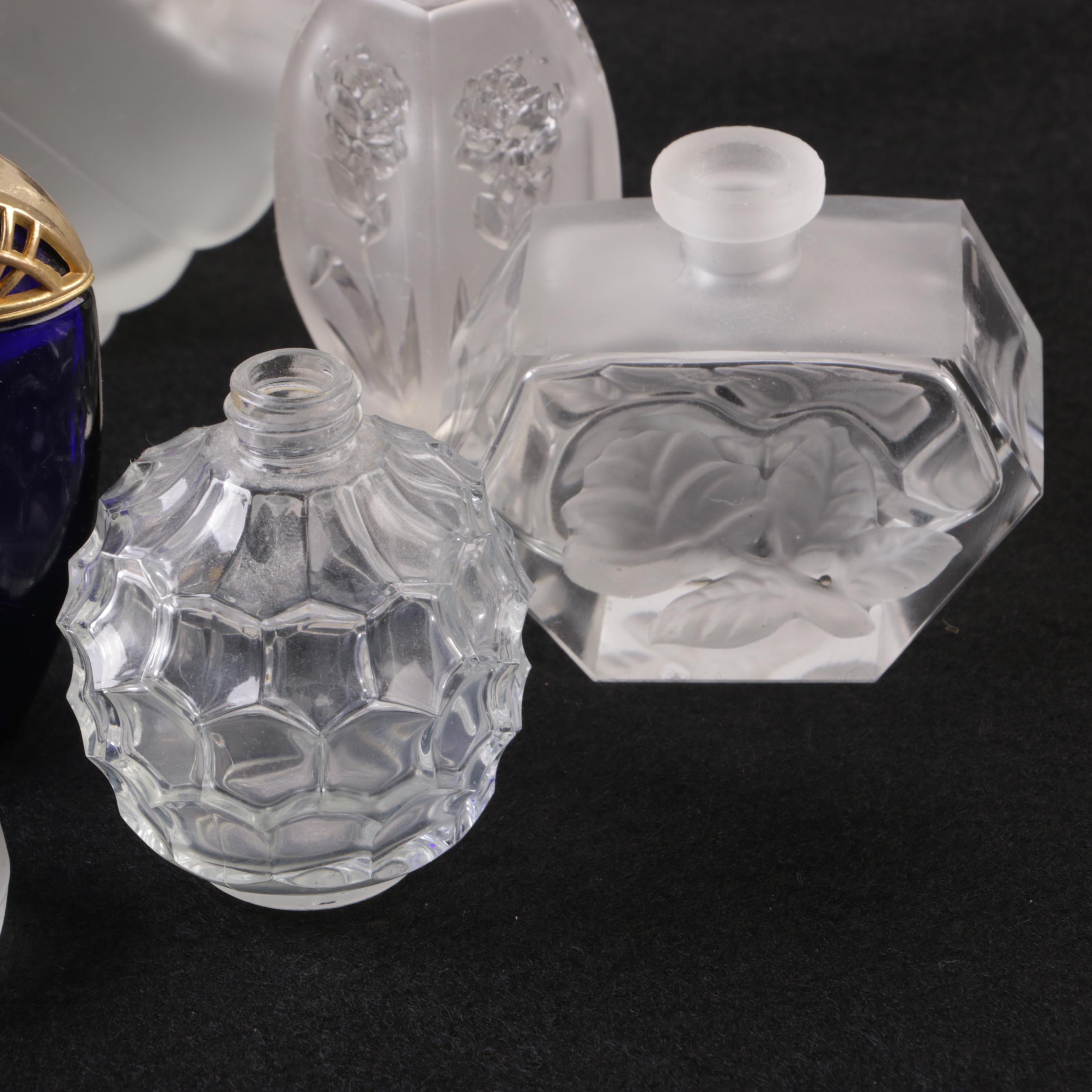 Perfume Bottles Including Avon "Mesmerize"