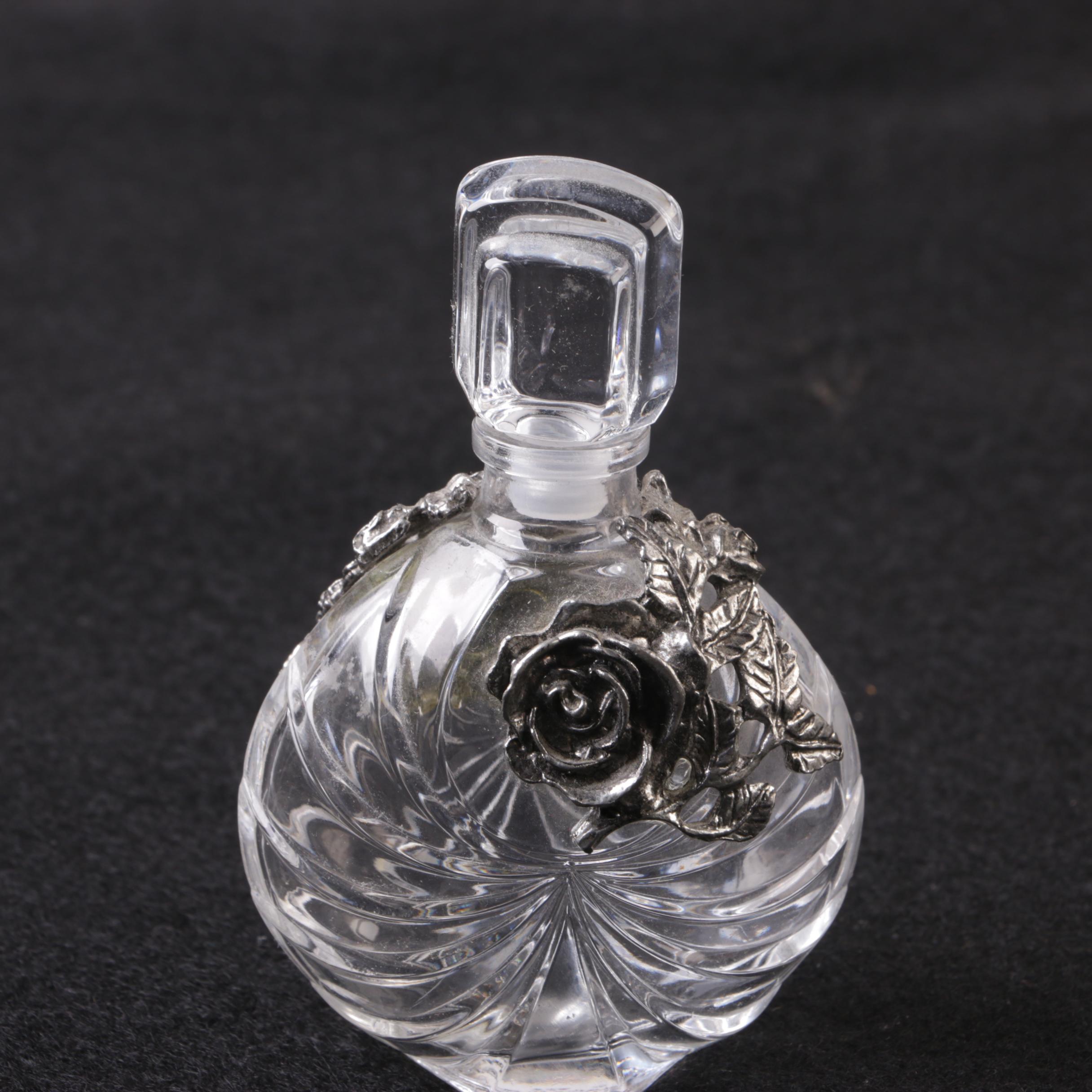 Perfume Bottles Including Avon "Mesmerize"