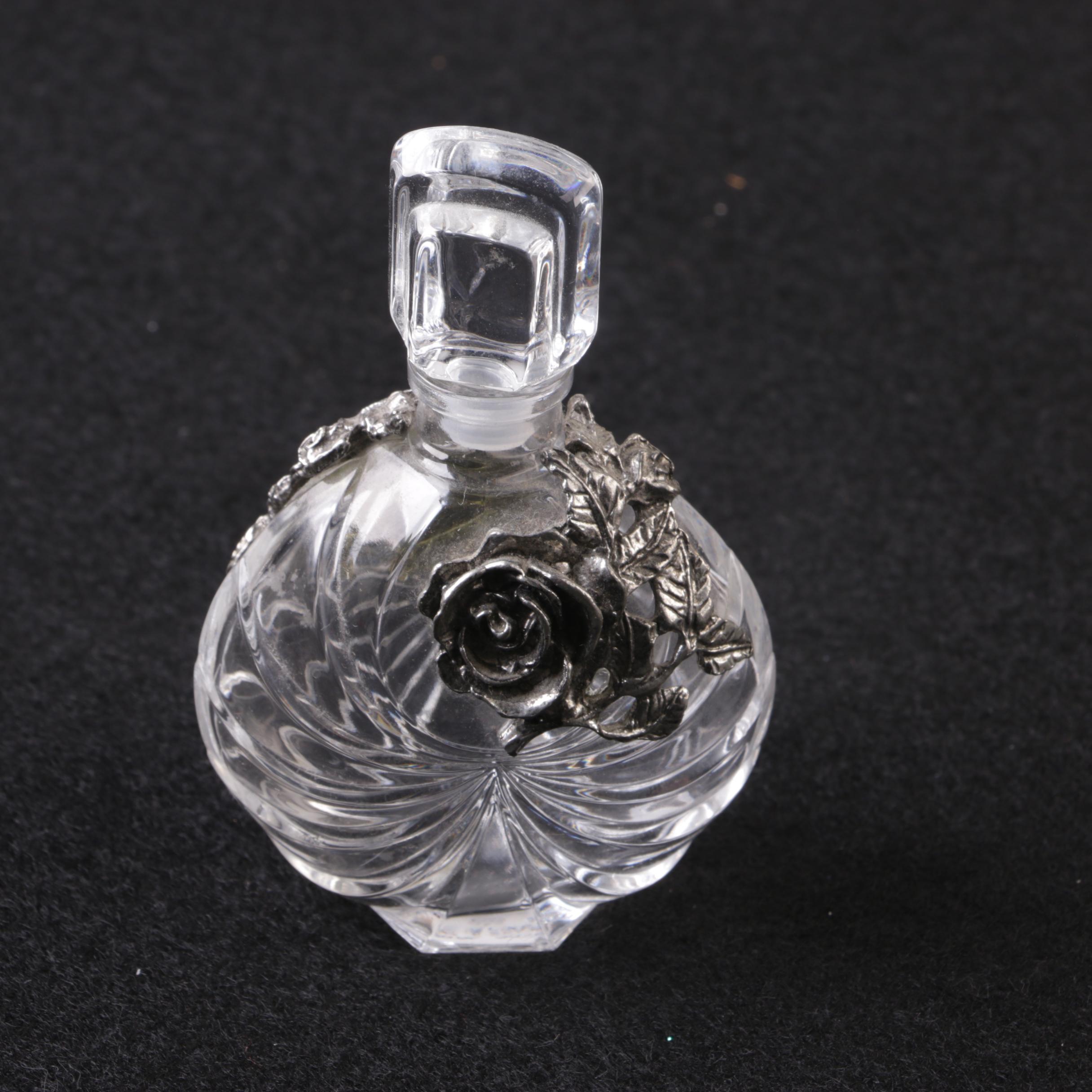 Perfume Bottles Including Avon "Mesmerize"