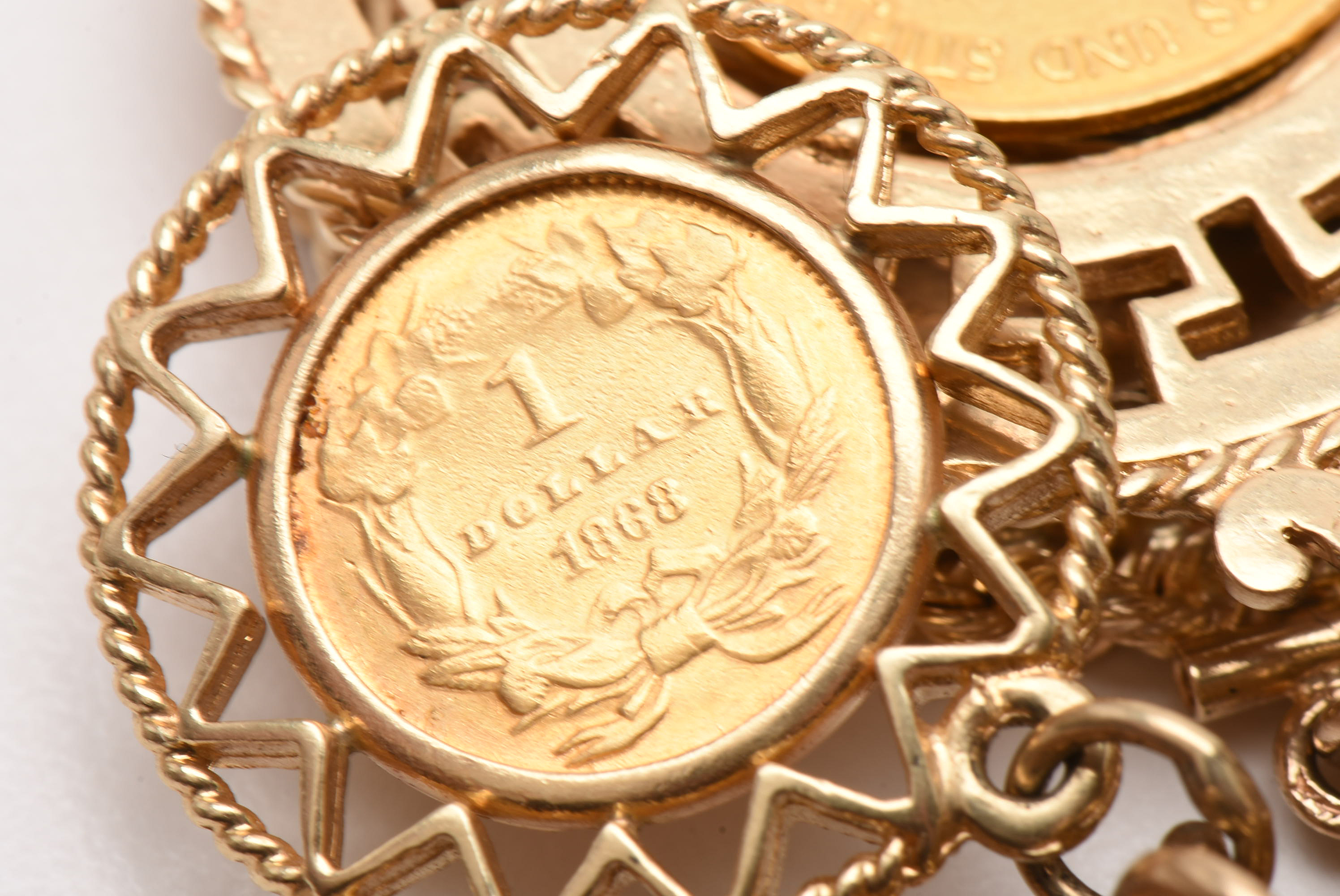 14K Yellow Gold Bracelet with Sixteen World Gold Coin Charms