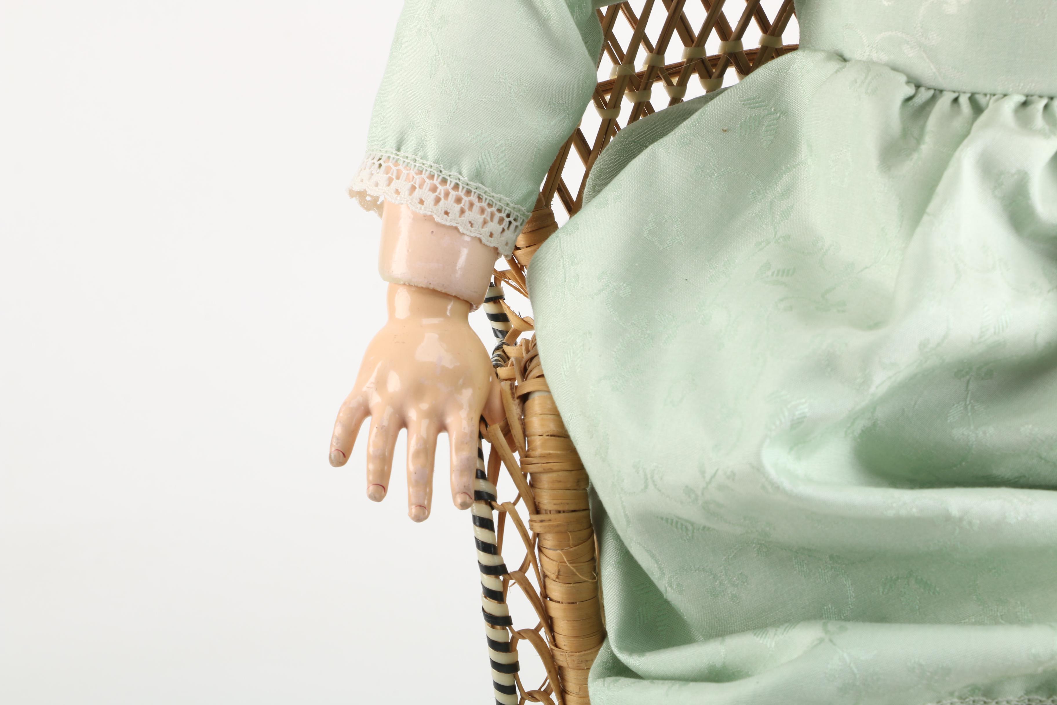 Vintage Doll and Wicker Chair