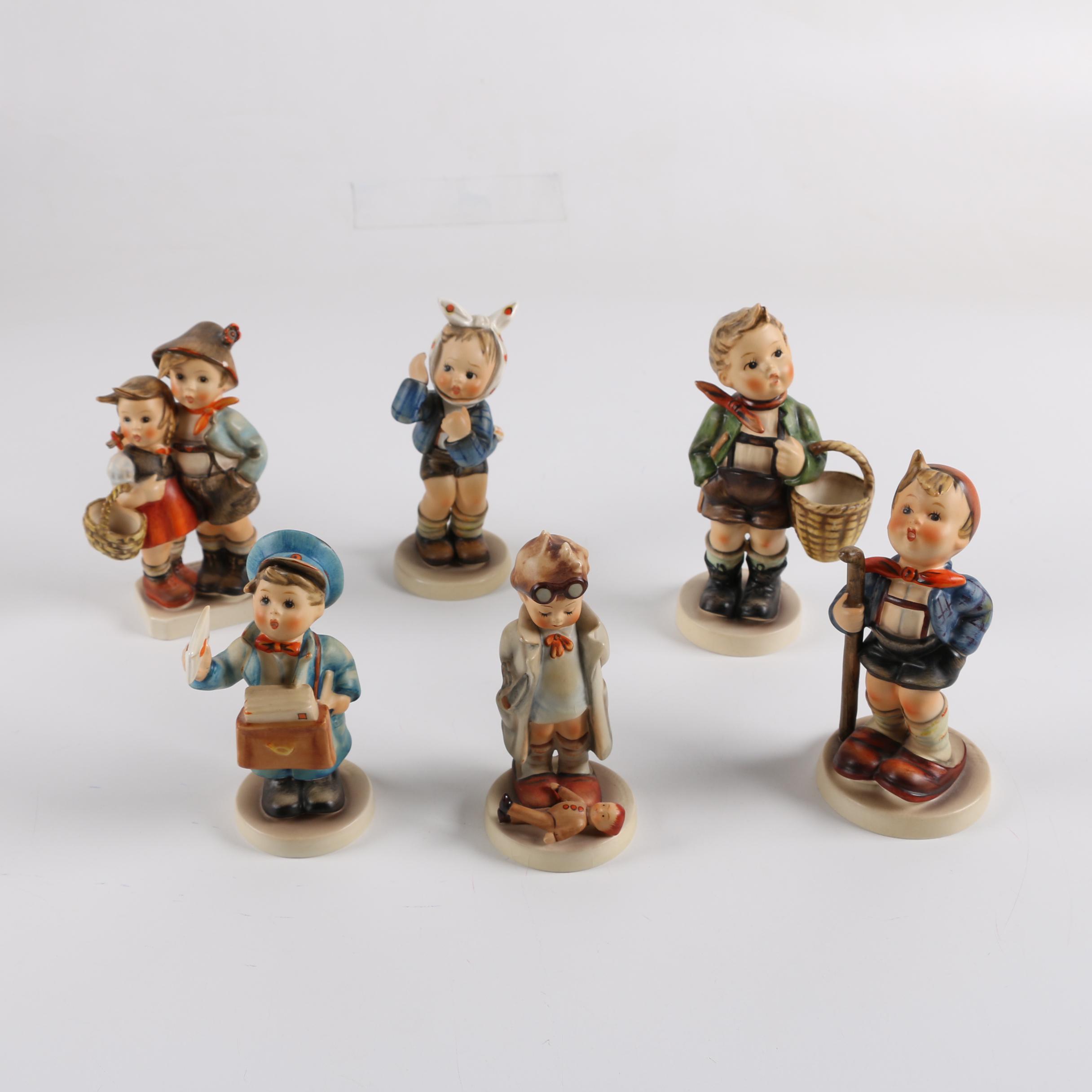 Vintage Hummel Figurines including "Little Hiker" and "Post Man"