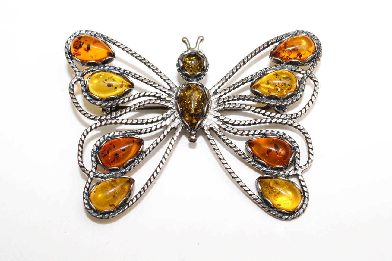 Sterling Silver and Amber Pendants and Figural Brooches including Sajen