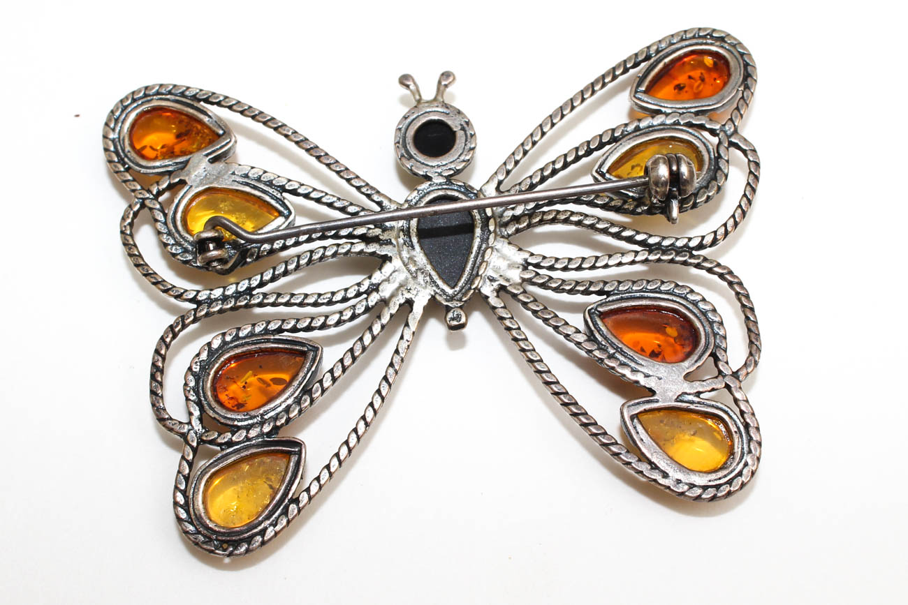 Sterling Silver and Amber Pendants and Figural Brooches including Sajen