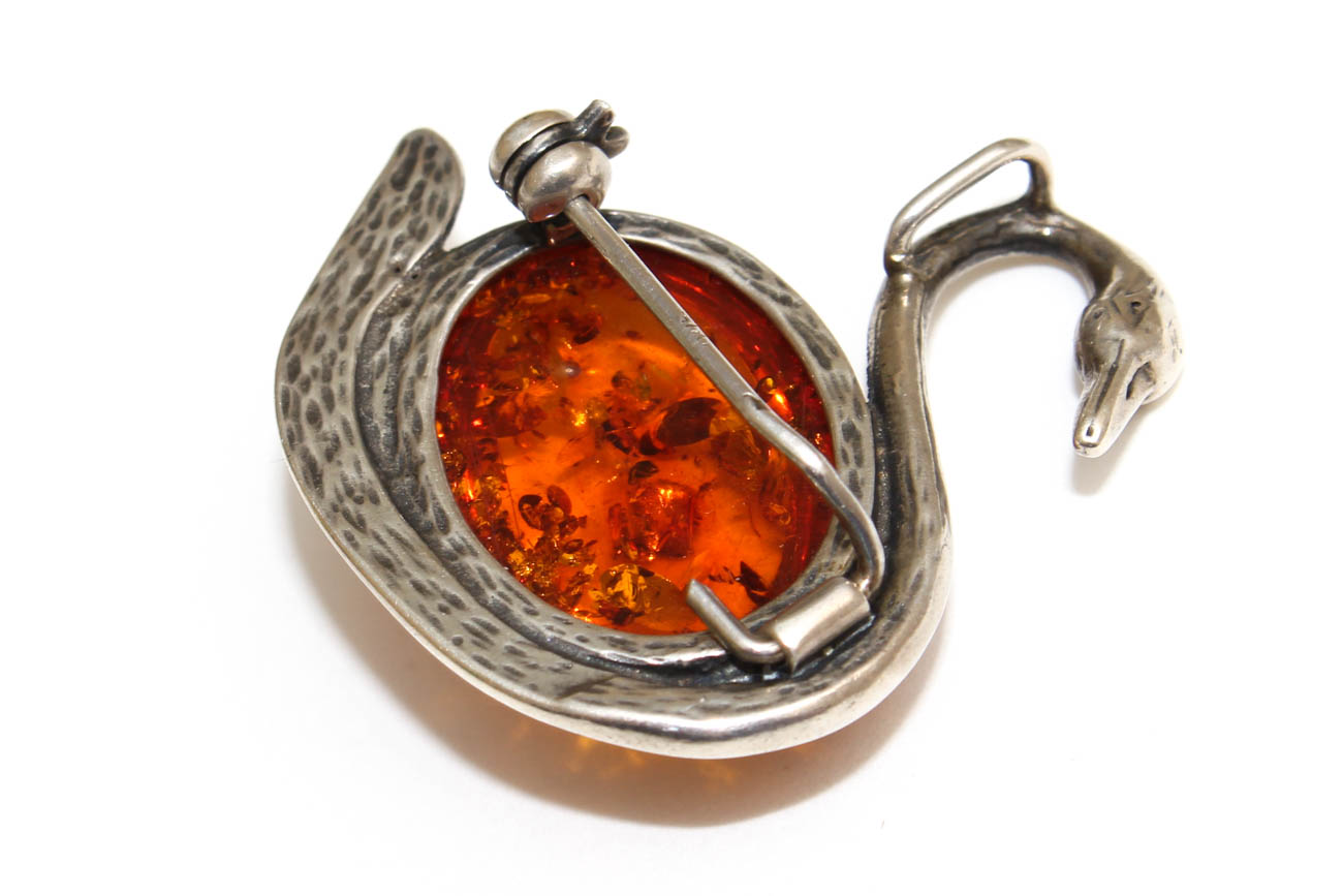 Sterling Silver and Amber Pendants and Figural Brooches including Sajen